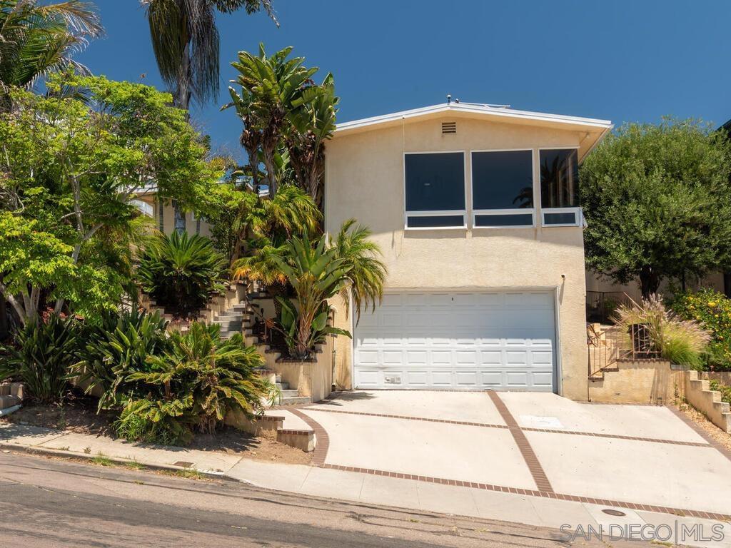 Experience coastal living at its finest in this Point Loma home, perfectly positioned to capture sweeping views of the bay and harbor. An added opportunity may exist to assume the current loan, offering a unique advantage for qualified buyers. The home also features owned solar panels that offset nearly all electricity costs for most of the year, providing significant savings and long-term value. Featuring four bedrooms and three bathrooms across an open and inviting floor plan. The main living area opens seamlessly to a wrap-around deck, ideal for entertaining or quiet evenings watching the sunset. A thoughtfully designed backyard offers a private jacuzzi, putting green, and multiple spaces to relax or host gatherings. Inside, a spacious kitchen, generous bedrooms, and well-appointed baths provide both functionality and style. A standout feature of this home is the fourth bedroom with its own private entrance, perfect for use as a guest suite, home office, or income-producing rental opportunity. Beyond its current appeal, the property is also prime for future development or expansion, as seen with neighboring homes that have built upward to maximize views and value. Located just minutes from Liberty Station, Shelter Island, and San Diego’s best beaches, this home offers a rare combination of lifestyle and convenience. Whether as a primary residence or a coastal retreat, this property delivers the very best of Point Loma living.
