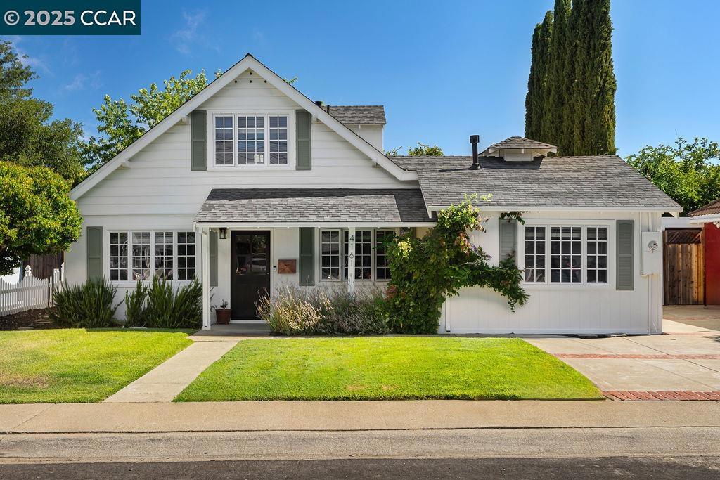 OPEN 7/26 & 7/27, 1PM-4PM! Located in the Canterbury Village community in Concord, this lovely home offers modern comfort and timeless charm! Step inside to a freshly painted interior and exterior, a warm and welcoming floor plan, engineered hardwood flooring, and an abundance of natural light throughout. At the heart of the home is the thoughtfully designed kitchen, featuring a center island, contemporary fixtures, and generous storage. The spacious laundry room adds extra flexibility, offering plenty of space to double as a home office or additional storage. With two bedrooms and one full bath on each level, the versatile four-bedroom layout easily accommodates a variety of living arrangements, whether you need room for guests, multigenerational living, or a private office. Outside, the flat lot and expansive backyard offers a serene retreat—ideal for entertaining friends and family or quiet evenings at home. The detached garage has been nicely finished, offering endless possibilities—perfect for a home gym or relaxed hangout space. This is your chance to enjoy comfort and a welcoming neighborhood all in one special home!