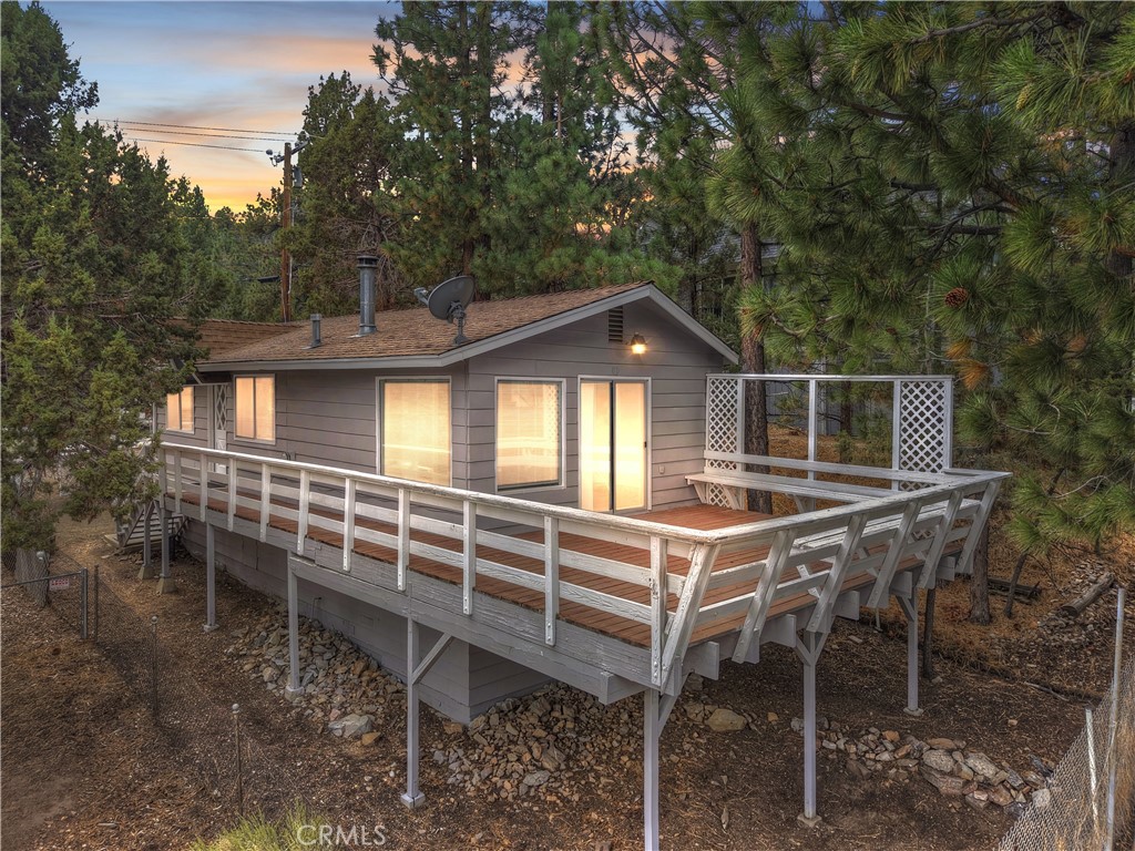 Tucked away on the quiet side of town, this cozy Big Bear home is just 10 minutes from shopping, schools, dining, and all the outdoor activities the valley has to offer ~ It’s the perfect spot for anyone looking to enjoy mountain living without giving up convenience ~ The home has had some nice updates throughout, making it move-in ready while still leaving room for you to add your personal touch. The living room can be used as a second guest bedroom utilizing the door to create privacy from the rest of the home ~ Level parking means easy access year-round, no steep driveways to worry about in the winter ~ You’ll love relaxing on the back deck with your morning coffee while listening to the wind in the pine trees ~ Close Proximity to the National Forest, just across the street for evening strolls as the sun sets ~ Underneath the house you’ll find a workbench and extra storage space, perfect for keeping tools, bikes, or seasonal gear organized. The yard is easy to maintain, giving you more time to enjoy the mountains instead of working on upkeep ~ Whether you’re ready to buy your first home or looking for a place to settle into full-time, this property offers comfort, convenience, and the chance to make Big Bear your everyday escape.