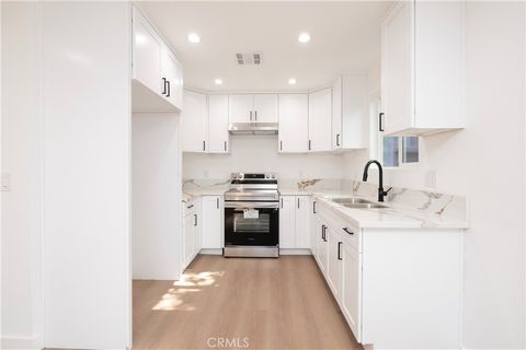 Photo of 5739 S St Andrews Pl #1/2, Los Angeles, CA 90062 (MLS # DW26058066)