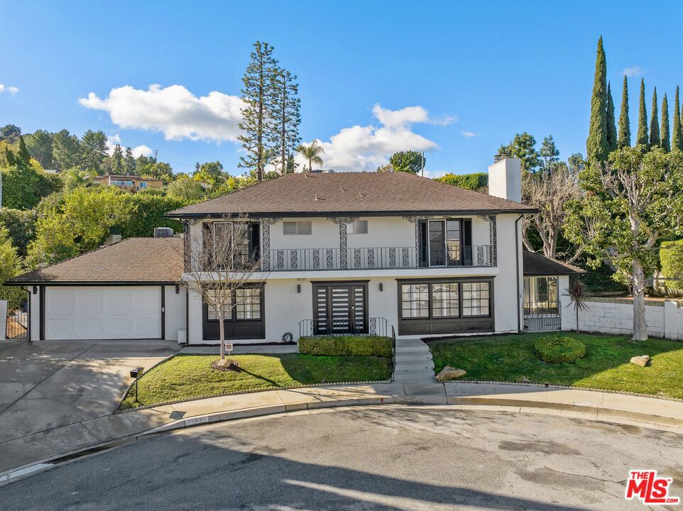 **Tenant occupied - earliest move-in date is 12/01/2025.** An expansive, fully renovated 5 bed / 3 bath house situated at the end of a cul-da-sac in one of the most desirable family-oriented neighborhoods - Royal Woods. The main level includes a full bedroom with connected en-suite, living room with fireplace, dining room, modern wet bar, spacious chefs kitchen containing 3 pantries and a dedicated breakfast nook, separate laundry area with new equipment, and a bonus room that can be utilized as a sunroom, gym, or creative space. The 2nd level contains 3 large bedrooms and the primary bedroom, each of which contain generous closet space. The primary bedroom includes a connected en-suite bathroom with a 72" double vanity, fireplace, and direct access to a 50+ foot balcony with a great view of the valley floor. All bedrooms can accommodate a king size bed in addition to nightstands, desks, and other furniture pieces. The house receives plenty of natural sunlight given its unimpeded positioning and large windows. The outdoor space is as expansive as the indoor space providing multiple areas to fulfill any entertainer's or family's needs. The house is equipped with a fully-automated outdoor Ring security camera/flood light system controlled via Smartphone in addition to a secure, high-end digital + keyed front door lock. The house contains an attached 2 car garage with a driveway that can accommodate additional parking as well. This house is turn-key and ready to become your new home today! Pets are allowed at the property with owner's consent. **Additional items that have been updated since the photos were taken: kitchen and wet bar countertops have been fully replaced with quartz and bedroom light fixtures have been replaced with ceiling fans.**