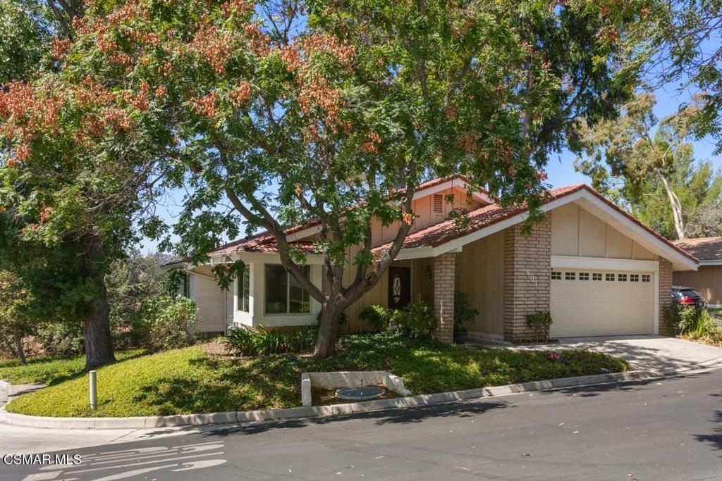 This 4 bedroom 3 bath home is located in an ideal Oak Park location on a small shaded private cul-de-sac. This home boasts over 2100 square feet of living space with a versatile floorplan. The layout is ideal for single story living. There is a large living room overlooking a wonderful open view of the surrounding hills and mountains. The living room is perfect for entertaining with its wonderful views and fireplace or used as a family room as it opens to the kitchen and dining area. The eat-in kitchen is good sized with plenty of cabinet and counter space space and has a pantry as well as an efficient desk/work station. The primary suite is just off this area with its spacious bath that includes a double sink vanity, step-in shower and large jetted tub that also enjoys the same wonderful mountain views. There are two other bedrooms that share a full-sized bath on this level. Downstairs is the perfect retreat featuring a bonus room perfect for entertaining or a home office. This room also enjoys a fireplace and a sliding door leading to a walk out patio with green space and beyond. Also downstairs you will find an additional bedroom and full bath. This home has wonderful views from the recently replaced energy efficient windows! There is a two-car direct access garage with a new overhead door, automatic opener, built-in cabinets and laundry hook-up. Excellent location minutes from shopping, restaurants entertainment, recreation and award-winning schools.