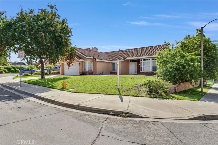 Charming Family Home nestled in "Sunnymead Ranch" community!   This 3 Bedroom, 2 Bath home is ideally situated on the corner lot of a quiet cul-de-sac street.  The living room features a cozy fireplace and adjoining dining area, perfect for gatherings.  Kitchen area has a large greenhouse window that fills the space with natural light.   Primary suite includes a walk-in closet, separate tub and shower, and direct access to the backyard through a sliding glass door.  Enjoy outdoor living under the large covered patio - ideal for entertaining or relaxing.  Additional features include attached 2 car garage with laundry hook-ups.  Conveniently located near community amenities: lake, pool, spa, playground, bike trails, shopping, schools, and easy freeway access.