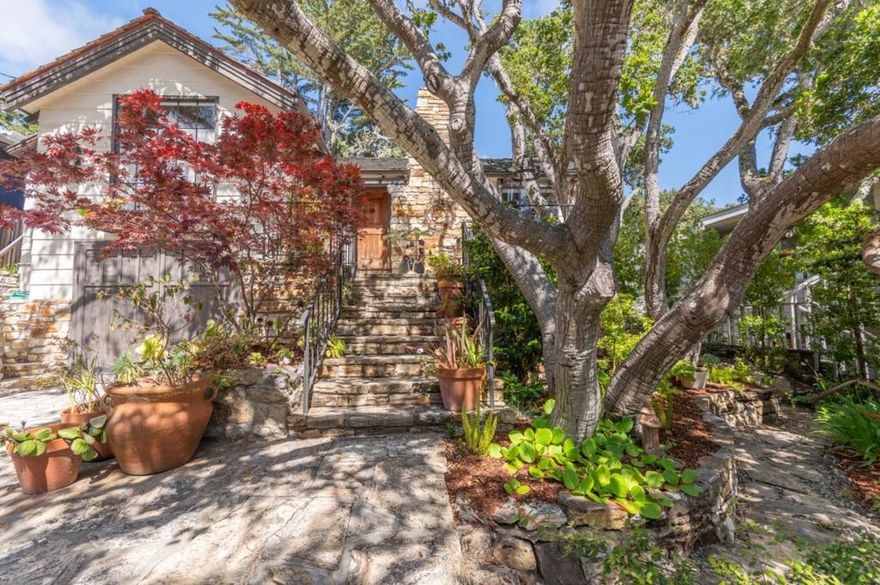 A perfect example of an Al Saroyan design and build in the heart of the village. Very privately sited at the back of an over-sized 5,000 square foot lot, the home emits a kind of magical, secret garden vibration. Rebuilt from a 1940's original Carmel cottage, this small but seamless home was done with the utmost attention to detail and craftsmanship. From the custom metal doors and windows, to hand-hewn beams and surfaces, its easy to see and touch the quality anywhere in or around the home.