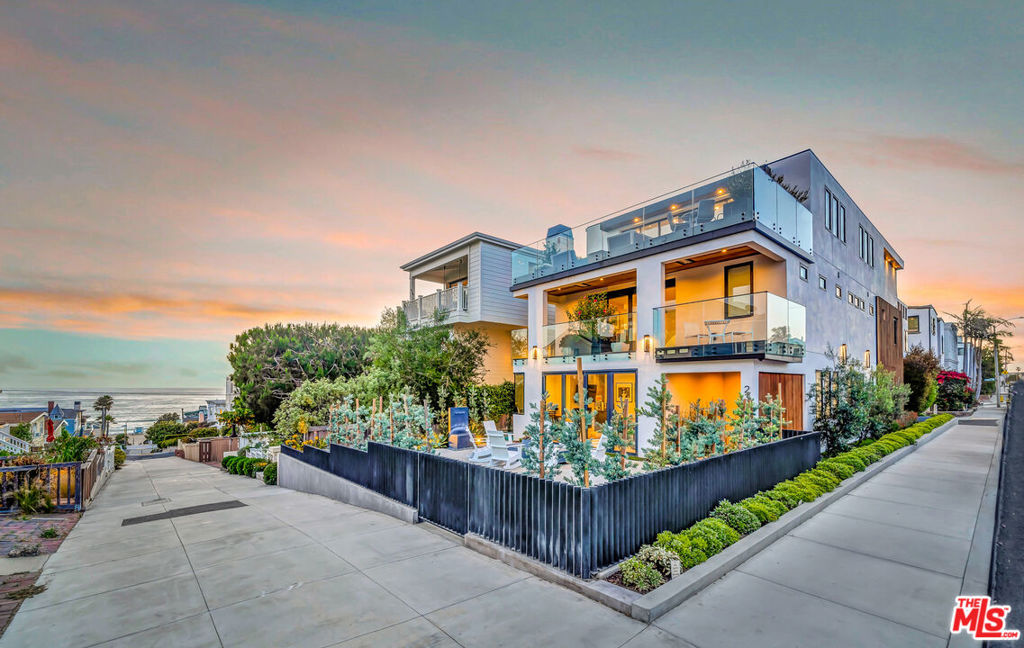 235 4th Street is beautifully set on an elevated corner lot on one of Manhattan Beach's most desirable walkstreets. With fantastic ocean views from two terraces, you're a leisurely stroll away from the beach, downtown and Manhattan Beach's iconic pier. The home's three levels are an entertainer's dream, featuring patios and terraces that honor the indoor-outdoor beach life. Among the countless luxuries the home provides it also features a gorgeous custom wine refrigerator and elevator. Your new home and life await you. Come see what and experience the elegance and energy 235 4th Street is all about.