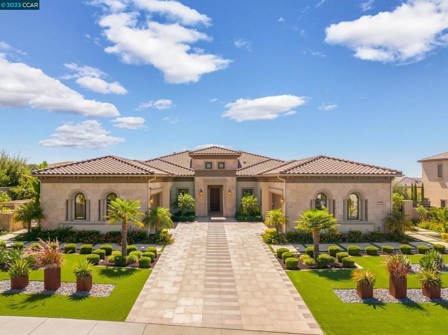 Stunning single-story home with volume ceilings. Conveniently located across from Blackhawk Country Club. Lot is over 2/3 acre, mostly flat, backing to view of hills & sunset. Blend indoor & outdoor living as the glass wall slides open from great room to loggia. Expansive grounds incl pool, spa, putting green, sports area, vineyard & four fire pits. Covered BBQ area features Lynx pizza oven & Heston grill. The indoor kitchen is a chef’s dream with Wolf & Sub Zero appliances, quartz counters, RH light fixtures, built-in espresso & more. Primary bedroom has a sitting area with sliding glass wall, dual closets & spa-like bathroom. Spacious guest suite has a separate entrance. Library is adjacent. The two other en-suite bedrooms are located perfectly next to a bonus room. Open floor plan has approx 4862sqft main house with 4 bedrooms, 4 ½ baths, library & bonus room.  Plus approx 556sqft detached casita/cabana with full kitchen & bathroom (could be 5th bedroom).  Tankless water heaters, multi zone HVAC, remote control blinds, apps for music & lighting. Solar owned electricity. 4 car garage (2+2) w Tesla charger.