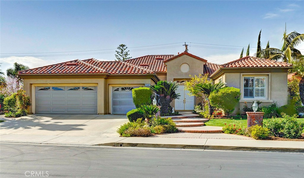 Welcome to 2140 Chandler Drive. Located beyond the prestigious 24 hour guard-gated entry of San Marino at Tustin Ranch, this elegant single-level estate presents an exceptional opportunity. With four bedrooms, three full bathrooms, and a guest powder room, the home offers multiple living spaces filled with natural light and refined finishes throughout. A grand walkway leads to the double front doors and opens into a formal living and dining room featuring high ceilings, a cozy fireplace, and an overhead skylight that fills the space with warm sunlight. The spacious great room includes a second fireplace, walls of windows, and a French door that opens to a private backyard with mature landscaping and walkways. The well-appointed kitchen is designed for the gourmet chef, complete with a new six-burner cooktop, brand new double oven and dishwasher, and a built-in Sub-Zero refrigerator. Whether entertaining guests or preparing a quiet meal at home, this kitchen is ready for it all. The primary suite is a true retreat with French doors that open to the backyard, a luxurious soaking tub, separate shower enclosure, and dual walk- in closets with custom built-ins. Two additional bedrooms share a full bathroom with dual vanities and another soaking tub, while the fourth bedroom is a private ensuite with its own full bath. A guest powder room is also conveniently located for visitors. Additional features include a three-car garage offering generous storage and parking, as well as a dedicated laundry room with a deep sink for added convenience. Tustin Ranch offers residents world-class dining, shopping, and entertainment just minutes away. The home is located within an award-winning school district that includes Ladera Elementary (adjacent to the gate), Pioneer Middle School, and the highly regarded Beckman High School just a short drive away. Single story homes in the coveted San Marino enclave are rarely available. Newly Painted throughout.