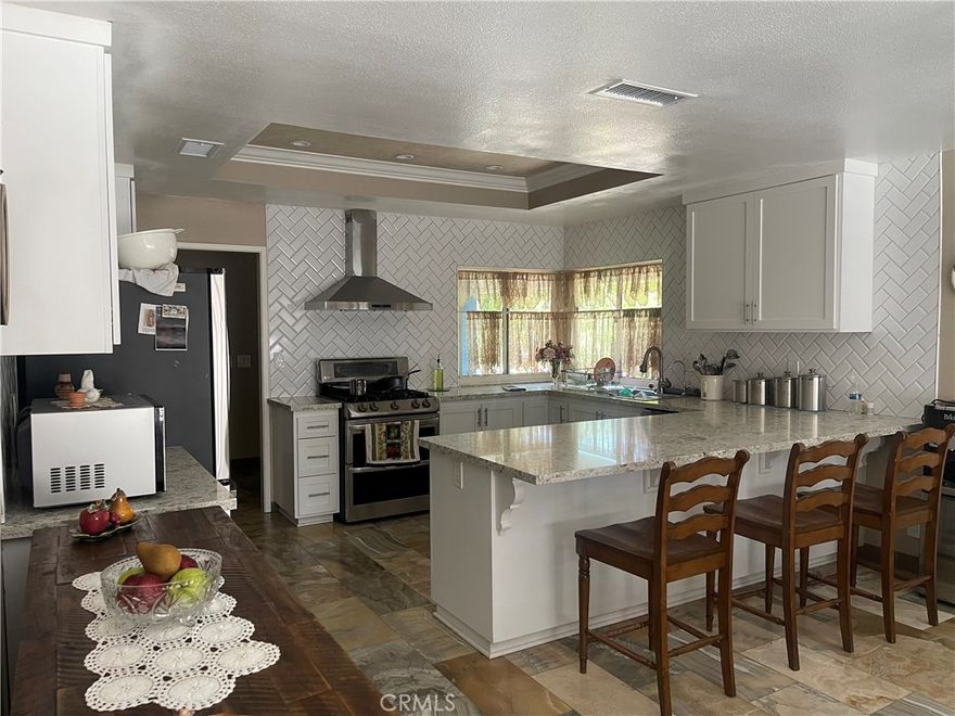 Newly remodeled home. Recently updated kitchen, bathrooms, shutters, marble countertops and floors throughout the entire home. New AC unit.