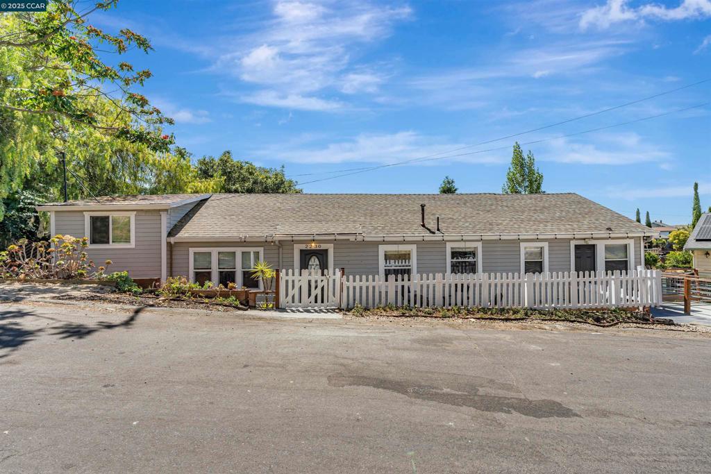 This exceptional and versatile property offers a rare combination of space, functionality, and flexibility. The 1280 square foot primary residence includes four bedrooms and two bathrooms, along with a separate 700-square-foot attached Inlaw unit -1 bedroom, 1 bath. Ideal for extended family, guests, or potential rental income. The main home features a light-filled, open-concept floor plan with a formal dining area which flows seamlessly into the living room. A kitchen showcasing a neutral color palette, quartz countertops, a central island, and abundant cabinetry for storage. The four bedrooms provide ample versatility for family living, guest accommodations, or remote work needs, while the layout is designed for both comfort and everyday convenience. At the back of the home, a private entrance leads to the Inlaw unit complete with a living area, full kitchen, bedroom, and bathroom. An additional generous storage space offers practicality for tools, seasonal items, or hobby equipment. Set on a generous lot, the property includes a fenced front porch and a fully enclosed backyard featuring an inviting outdoor entertaining area, a chicken coop, plenty of room for gardening or stargazing at night. Located near historic downtown Martinez, indulge in endless dining and shopping.