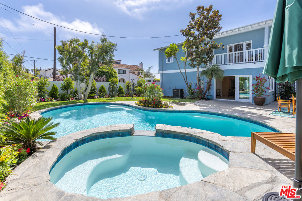 Absolutely gorgeous, entirely remodeled, Modern, light & bright California Craftsman home. Offering a picture-perfect venue, understated elegance for family or entertaining -- all within an idyllic setting just one block from the very desired Pacific Palisades Medio Bluff, which provides a natural ocean breeze and airy, resort-like setting. This is elegant living at its very finest. Top-rated charter schools for all grade levels. The house features 5 bedrooms, plus large entertainment room, 4.75 baths sitting on a 9,047 sf ft lot with a stunning backyard featuring a custom 45-ft custom Flagstone pool, jacuzzi and newly installed large Master BBQ and entertaining bar, which is perfect for family or entertaining. This Custom California Craftsman 3,729 interior sf luxury residence has been completely remodeled and showcases premium finishes, thoughtful design and exceptional tranquility. The stunning main level welcomes you with newly refinished wide-plank Rift White Oak floors and rich crown molding throughout, and a welcoming gorgeous powder room. There are three downstairs bedrooms, which are perfect for family or guests, whom will enjoy designer tiled bathrooms. The large Cooks Kitchen is Perfect, designed for the modern Chef with top-of-the-line new appliances, including 7-burner gas range & grill, Quartz Stone counter tops, and a Large Island ideal for engaging conversations with family and guests. Sun-drenched dining room and breakfast area boast a view of charming patio/garden and backyard. The house features two wonderful Rift White Oak encased wood-burning fireplaces -- one in the living room and second in the large Master Suite. Upstairs offers a peaceful, Zen-like experience within the oversized Master Suite, featuring vaulted ceilings, a direct view of the Palisades Mountains and peek-a-boo Ocean View from a large balcony, vast walk-in closet. The Master Bath has a spa-like soaking tub, large shower and dual vanity. Rounding out the second level are two additional bedrooms, both overlooking the backyard -- one is oversized and perfect for an entertainment room or playroom. The upstairs laundry room has large, side-by-side washer/dryer. Large 60' by 12' private RV/boat/car collection parking. This home is not to be missed.