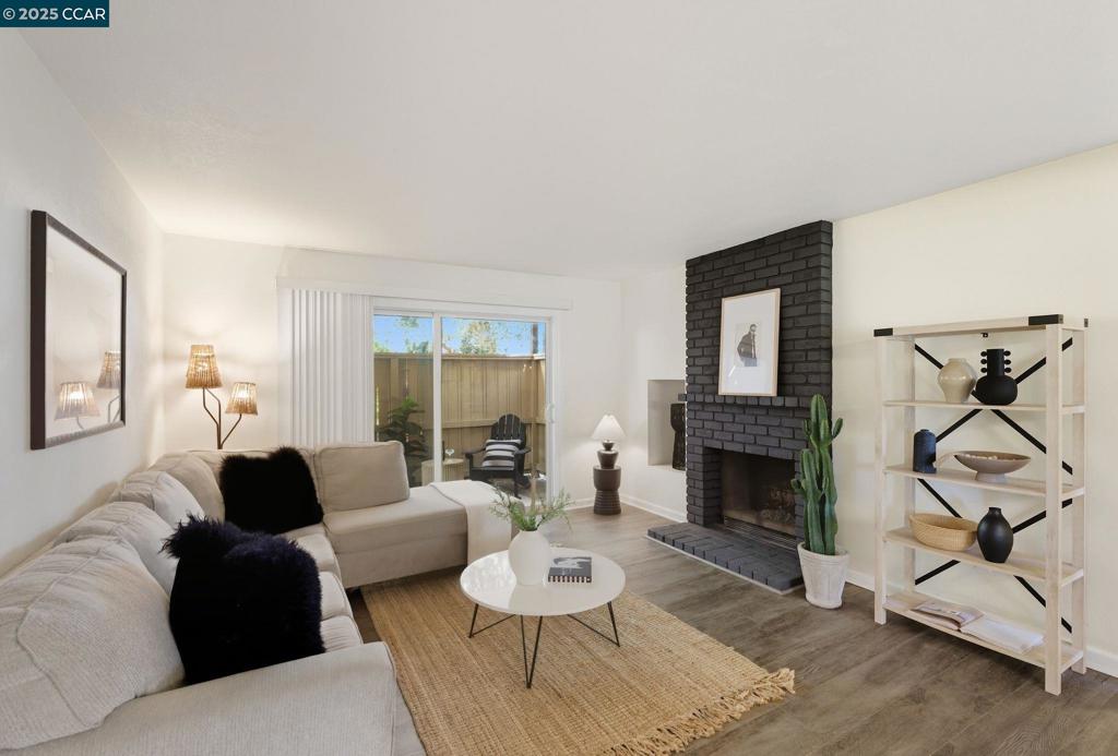 Welcome to 2055 Sierra Road, Unit 71 — a spacious and private end-unit condo in the heart of Concord. This desirable 3-bedroom, 2-bath home offers a smart layout with abundant indoor and outdoor living. The living room opens to an expansive patio, also accessible from the first bedroom, perfect for entertaining or enjoying fresh air. The primary suite is a true retreat, featuring a wall-to-wall closet and its own private patio overlooking the canal and lush greenery. Inside, you’ll find updated finishes, beautiful vinyl plank flooring throughout, and brand-new appliances for a modern feel. The primary bath includes a stall shower, while the second bath has a shower-over-tub combo. Added conveniences include an in-unit laundry room and storage is plentiful with an oversized exterior storage closet, ideal for holiday décor or recreational gear. Two deeded parking spaces—one covered, one uncovered—are included. Community amenities feature a pool, hot tub, and sauna. All in a prime location across from Costco, near restaurants, and minutes to Concord BART. Quiet, private, and move-in ready, this home is a rare find.