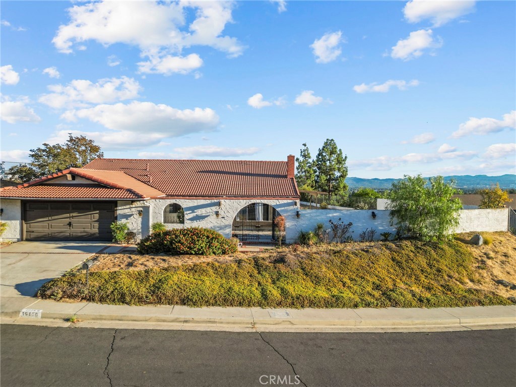 VIEWS! VIEWS! VIEWS! Perched on nearly 17,000 sq. ft. in Porter Ranch, this Spanish-style home offers 4 bedrooms, 2 bathrooms, an office, and a workshop—blending character, space, and modern upgrades. Inside, enjoy thoughtful improvements including solar panels, a new electrical panel, copper plumbing, water heater, dishwasher, and an advanced HVAC system (21 SEER AC with new ducts, registers, and returns). Additional upgrades include an energy-efficient tile roof, updated gutters and drain pipes, car charger, and hardwired security cameras for peace of mind. Step outside to an expansive backyard that begs for a pool—bring your designer’s eye and create a private oasis while soaking in sweeping Valley views. Bonus: potential to assume an existing loan at an incredible 2.75% interest rate. This is a rare opportunity to own a beautifully updated Porter Ranch home with limitless potential, unbeatable views, and lasting value.