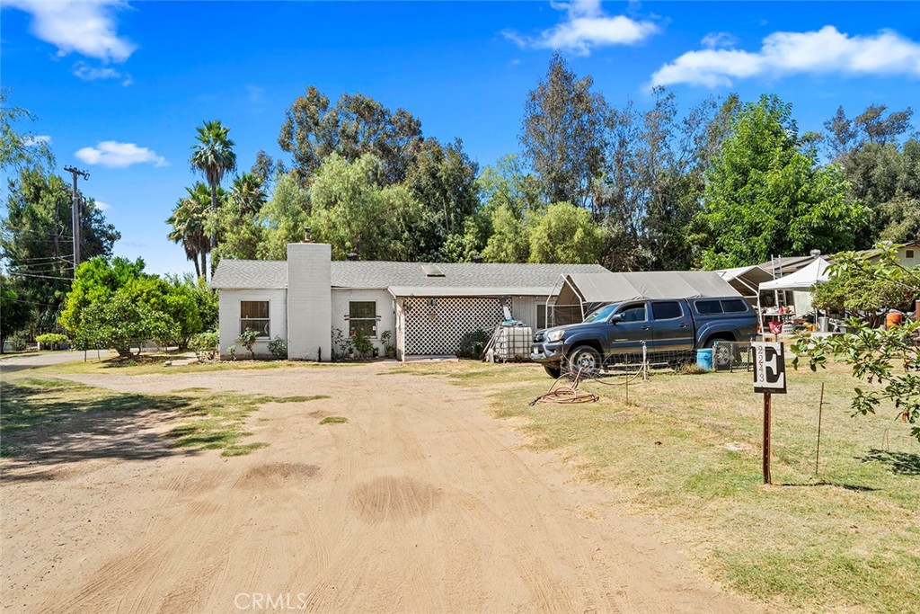 Dreaming of a charming single-story ranch-style home on nearly half an acre lot, complete with a detached two-car garage and plenty of space for gardening with mature fruit trees—all while staying close to the freeway? Look no further.
This home is currently configured as a two-bedroom, with the potential for a third bedroom in a large bonus room currently used for storage and indoor laundry. The home recently had some updates, including granite countertops in the kitchen, a recently updated bathroom, and a mini-split system in the living room for energy-efficient comfort. Multiple ceiling fans throughout the home add to its livability, and the roof was replaced just two years ago for peace of mind plus OWNED solar!
Included in the sale are the refrigerator, washer, and dryer. Outside, you’ll find a detached garage with additional storage space, as well as a spacious backyard—perfect for gardening, play, or simply relaxing in your own private retreat.
Don’t miss the chance to make this inviting home yours!