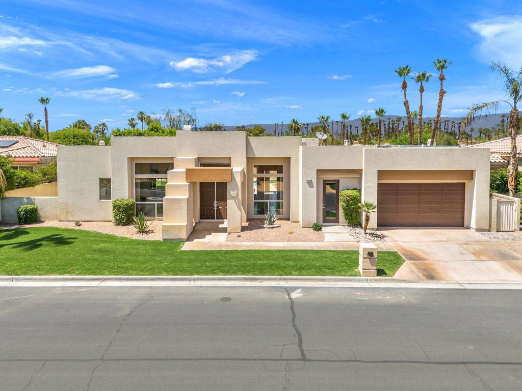 Experience the luxury in this exquisite FOXX custom-built contemporary home has to offer, featuring a stunning pool and spa, nestled in the privacy of the gated Sunterrace community. Renowned for its open and modern floorplan, this home is celebrated as the pinnacle of layout and design by the builder. Upon entering the double doors, you're greeted by a breathtaking view of the main living area, dining room, and kitchen, all overlooking the sparkling pool, spa waterfall, and patios. The high ceilings and abundant natural light create a bright and airy ambiance. The social kitchen is equipped with an island and granite countertops, under-counter seating, and a cozy nook with ample storage and a slider to the patio and outdoor living area. Each of the bedrooms has a full bathroom and the spacious primary bedroom suite includes a sliding glass door to the back patio for easy pool access, a dual vanity, an oversized shower, and a walk-in closet in the primary bathroom. A 4th bedroom or home office is situated on the guest wing with a separate door for entry or exit to the patio. The expansive back patio is a private oasis. There is potential to build a casita, ideal for office, game room or private guest quarters. A large 2 car garage with plenty of storage. Waiting to pass this joyful abode to the next family!