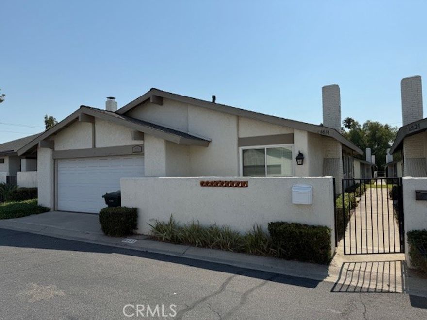 LEASE IN THE CITY OF YORBA LINDA! IN THE LOVELY COMMUNITY OF WOODGATE!  This 3 bedrooms, 2 bath, 1,002 sq ft single story, fully detached condominium property sits among a community of 231 units.  It has been remodeled and features throughout the house dual pane windows, travertine and wood flooring.  Each room has a ceiling fan with remote, modern lighting fixtures, electrical upgrades, water softener, vinyl window shutters, newer A/C unit, large walk in closets and designer paint! The kitchen is a chef's dream: spacious island with 4 burners and copper prep sink with ample seating, shaker style custom cabinetry, stainless steel appliances (with refrigerator staying), quartz countertops, marble backsplash and over size porcelain farm style sink.  Stylish barn doors to the Primary Bedroom which has natural lighting and large walk in closet.  Full bathroom ensuite with quartz counter vanity, custom glass walk in shower with river rock and a luxurious rain shower head.  The front bathroom has been updated with a door to the other bathroom so there is access to the shower.  Direct access to the 2 car garage and where the laundry is located.  (Washer & Dryer are staying).  Woodgate community has a clubhouse and 2 pools, one of which is a kiddie pool.  Public access to Woodgate Park so enjoy the basketball court, tennis & racquet ball/handball court and a grassy area.  *See photos showing modification of bathroom with additional door.*