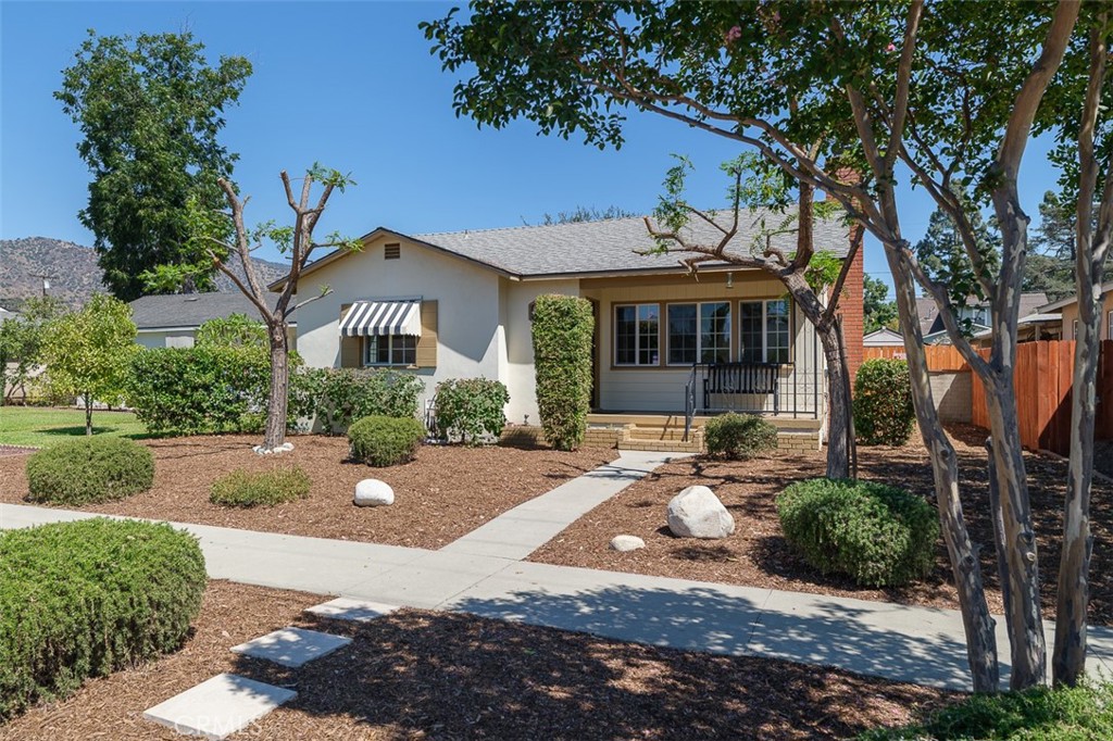 A precious single story character home situated on a beautiful street in sought after North Azusa area. Located in a great walkable and quiet neighborhood. Fantastic curb appeal with a sweet covered porch for relaxing. Situated amongst lots of pristine well manicured homes. This property features a large lot with a detached oversized garage, accessed from the back of the property with parking for multiple vehicles or an RV outside of garage. Home fhas 2 spacious bedrooms + enclosed patio (that can easily be added to square footage) + 1 bathroom, living room with fireplace, large kitchen with newer appliances and a laundry room with washer and dryer, hardwood flooring, newer central air conditioning and heating system, newer double pane windows, newer composition roof and newer water heater. The property has a wonderful large fully enclosed private backyard with a shed ready for a buyers garden vision. The oversized detached fully finished garage is great for vehicle parking/ workshop or a plan for a fabulous ADU with separate entry. There is so much potential to this property but also perfect and in move-in condition now and most importantly with a Fanstastic price. Won't last come and see.