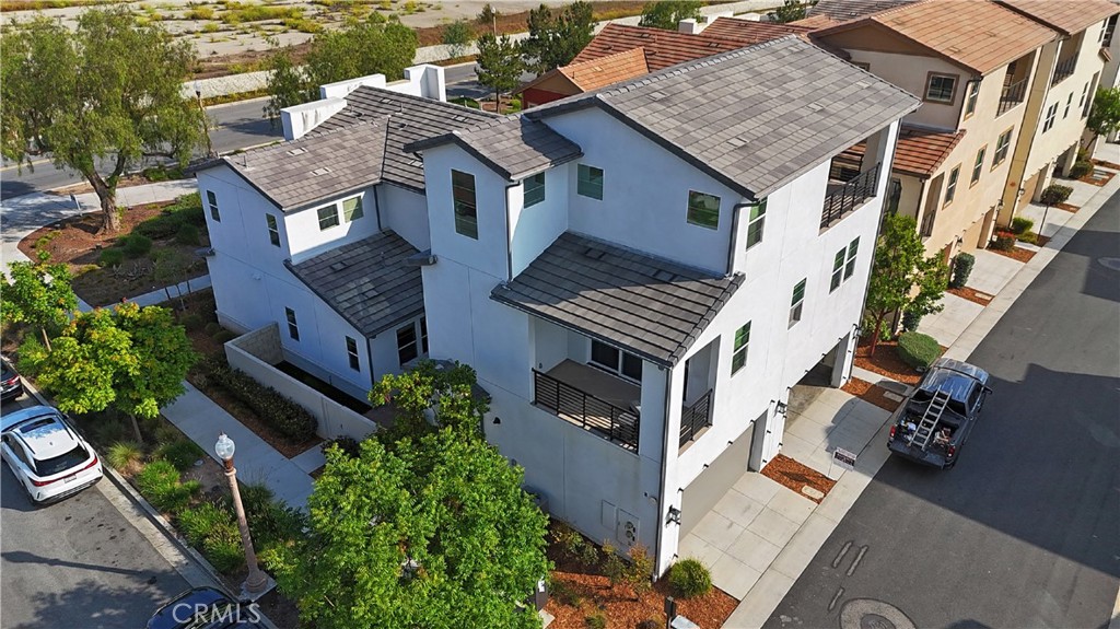 Welcome to your dream home at 101 Pusan, Irvine, CA 92618, nestled in the vibrant heart of the Great Park neighborhood. This stunning residence is just a leisurely stroll away from top-tier schools (Cadence Park School K-8, and Portola High School), inviting pools, exclusive clubhouses, and lush parks, ensuring everything your family desires is within reach.
Spanning an impressive 2,892 square feet, this home is a masterpiece of design and comfort. It boasts 3 cozy bedrooms, 2.5 modern bathrooms, and a spacious 2-car garage. Not to mention, it features two expansive balconies and a magnificent activity room that promise endless possibilities for leisure and social gatherings.
Upon entering, you're greeted by a generous 2-car garage on the ground level. The magic unfolds as you ascend to the second floor, where an open-concept living space bathed in natural light awaits. This floor is an entertainer's dream, featuring not only breezy balconies but also a gourmet kitchen complete with a walk-in pantry, ensuring that hosting is both elegant and effortless. The master suite, alongside two additional bedrooms, two full bathrooms, a convenient guest restroom, and a laundry room, round out this floor, offering a blend of luxury and practicality.
The second and third floors are uniquely designed with all four walls detached from neighbors, ensuring natural light from all sides, creating a living experience reminiscent of a single-family home.
But there's more—is a third-floor activity room with an oversized balcony that provides breathtaking views and a versatile space for hobbies, workouts, or simply unwinding under the sky.
Positioned on a coveted corner lot, this property boasts unparalleled views and exceptional sunlight exposure, ensuring every corner of your new home is illuminated. This isn't just a house; it's a gateway to the lifestyle you've always dreamed of. Don't miss the opportunity to own a slice of Irvine's finest. Come see why 101 Pusan is more than a home—it's a haven for those who appreciate the finer things in life.