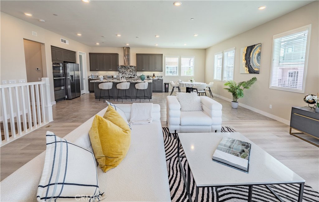 Welcome to your dream home at 101 Pusan, Irvine, CA 92618, nestled in the vibrant heart of the Great Park neighborhood. This stunning residence is just a leisurely stroll away from top-tier schools (Cadence Park School K-8, and Portola High School), inviting pools, exclusive clubhouses, and lush parks, ensuring everything your family desires is within reach.
Spanning an impressive 2,892 square feet, this home is a masterpiece of design and comfort. It boasts 3 cozy bedrooms, 2.5 modern bathrooms, and a spacious 2-car garage. Not to mention, it features two expansive balconies and a magnificent activity room that promise endless possibilities for leisure and social gatherings.
Upon entering, you're greeted by a generous 2-car garage on the ground level. The magic unfolds as you ascend to the second floor, where an open-concept living space bathed in natural light awaits. This floor is an entertainer's dream, featuring not only breezy balconies but also a gourmet kitchen complete with a walk-in pantry, ensuring that hosting is both elegant and effortless. The master suite, alongside two additional bedrooms, two full bathrooms, a convenient guest restroom, and a laundry room, round out this floor, offering a blend of luxury and practicality.
The second and third floors are uniquely designed with all four walls detached from neighbors, ensuring natural light from all sides, creating a living experience reminiscent of a single-family home.
But there's more—is a third-floor activity room with an oversized balcony that provides breathtaking views and a versatile space for hobbies, workouts, or simply unwinding under the sky.
Positioned on a coveted corner lot, this property boasts unparalleled views and exceptional sunlight exposure, ensuring every corner of your new home is illuminated. This isn't just a house; it's a gateway to the lifestyle you've always dreamed of. Don't miss the opportunity to own a slice of Irvine's finest. Come see why 101 Pusan is more than a home—it's a haven for those who appreciate the finer things in life.