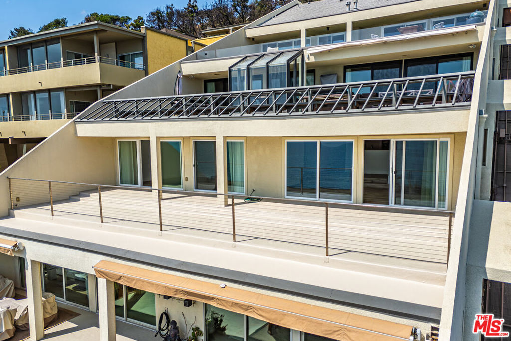 Modern 2-Bedroom Condo with Breathtaking Ocean Views. Experience coastal luxury in this spacious, contemporary 2-bedroom condo boasting spectacular, unobstructed views of the Pacific. Designed for comfort and style, this residence features a private 3-car garage, a built-in sauna, and a newly finished deck spanning nearly 1,000 square feet perfect for soaking in dazzling sunsets and ocean breezes. The primary Bedroom with a walk-in closet offers a serene retreat with an en-suite bath that includes a soaking tub overlooking the water, a floating dual vanity, and elegant finishes throughout. The kitchen is equipped with sleek black stainless steel appliances, quartz countertops, and custom high-gloss white cabinetry. Freshly painted walls, Italian interior doors, and porcelain tile flooring elevate the ambiance across (almost) 2,000 square feet of refined living space. Every detail has been thoughtfully curated to complement the panoramic views and modern design. This is more than a home it's a lifestyle. Come see it, feel it, and experience it for yourself. Minutes from the waves, the Getty Villa, and much more.
