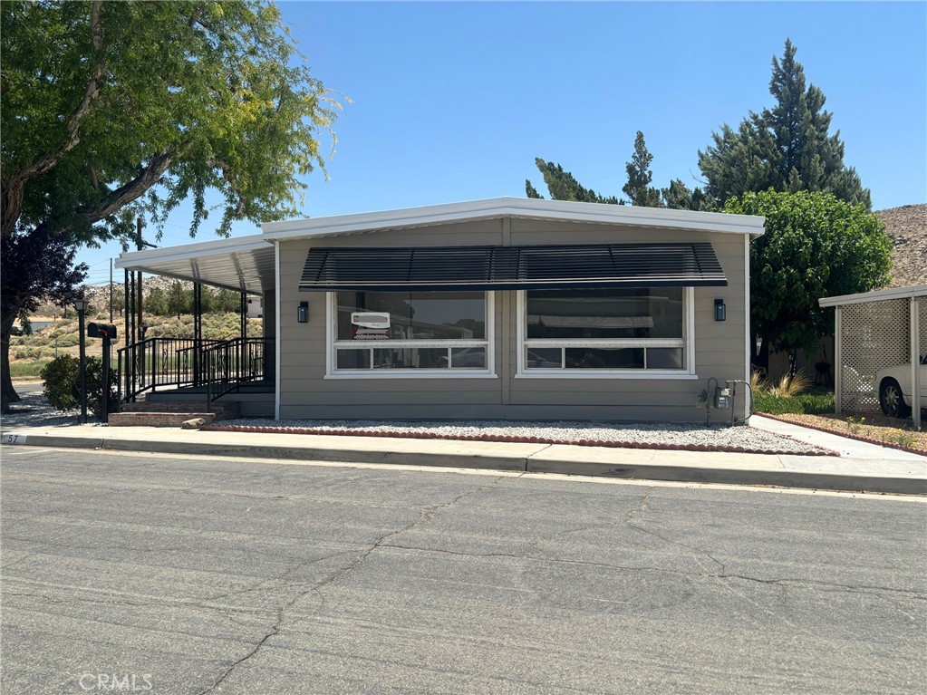 Beautifully remodeled Mobile home with tasteful upgrades and modernized kitchen appliances. This unit has new flooring throughout, new interior & exterior paint, remodeled bathrooms and a huge bonus room off the kitchen. New house heater and water heater has been installed as well as new maintenance free landscaping. The unit has ample room boasting 2 master bedrooms, formal dining area, large living room, eat in kitchen area and it has its own laundry room. This unit is ready to move in, so bring your clients to see this one & they will love it.