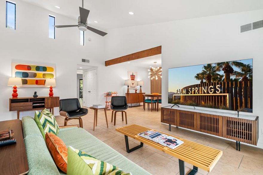 Discover refined elegance and effortless style in this beautifully updated and fully furnished 2-bedroom, 2-bathroom residence located in the highly desirable Little Beverly Hills neighborhood within The Palms gated community. Completely remodeled from top to bottom, this light-filled home offers an open, spacious floor plan designed for modern living. Soaring vaulted ceilings with clerestory windows flood the space with natural light, creating an airy and inviting atmosphere. Step out onto the private terrace to enjoy breathtaking views of Mt. San Jacinto, the community pool and spa, and lush, mature landscaping ... the perfect setting for relaxing or entertaining. The stunning, fully redesigned kitchen features new custom cabinetry, quartz countertops, a designer Art Deco backsplash, and chic mid-century-inspired lighting. The luxurious primary suite is a true retreat, showcasing a custom oversized closet system, stylish wall coverings, and a completely remodeled spa-like bathroom with full tile surround and a custom rain shower. A second private balcony adds an extra touch of exclusivity. The spacious guest bedroom also impresses with custom wall coverings and a frosted-glass closet system. The laundry closet includes a full-size side-by-side Samsung washer and dryer with ample storage. Residents of The Palms enjoy resort-style amenities including two sparkling pools and spas, expansive sun decks, outdoor grilling areas, a tennis court, and four pickleball courts. Ideal as a full-time residence, stylish second home, or high-performing vacation rental, this exceptional property truly has it all.