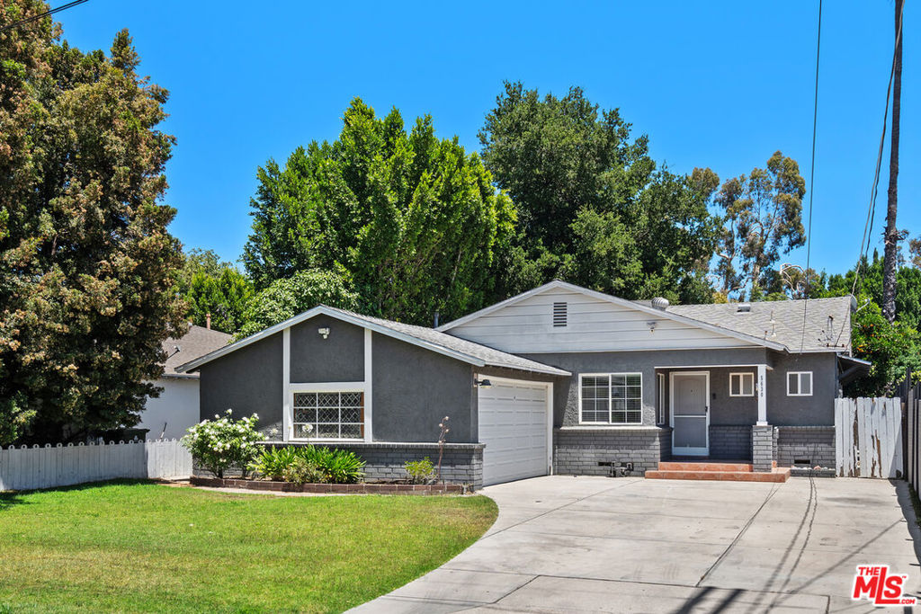 Located on a cul-de-sac, is this updated 3-bedroom, 2.5-bath home. The open living and dining areas flow into a bright kitchen with stainless steel appliances and plenty of storage. A large sunroom adds flexible space for an office, playroom, or studio. Convenient features include an indoor laundry room and a guest powder bath. The primary suite offers a walk-in closet and a modern private bathroom. Outside, enjoy a private backyard with a patio. Centrally located in Valley Village, close to shopping, dining, and transportation.