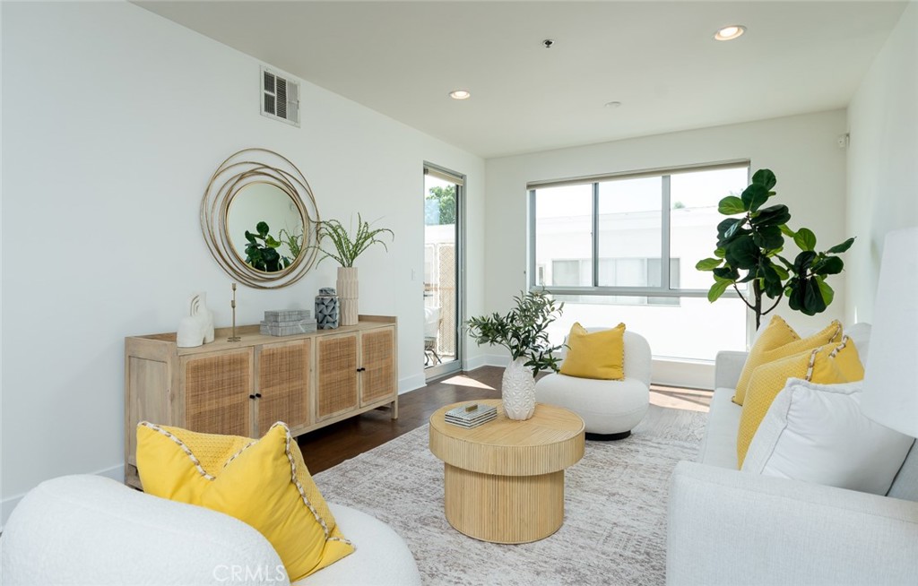 Welcome to 817 N Alfred #205 — a stylish, contemporary 2-bedroom, 2.5-bath residence perfectly positioned just moments from La Cienega, Melrose Place, and some of the best cafés, dining, shopping, and nightlife in Los Angeles. This south-facing home offers 1,340 sq. ft. of bright living space with timeless finishes throughout. The kitchen is designed for both function and style, featuring stainless steel appliances and sleek cabinetry. The primary suite boasts a luxurious en-suite bathroom with a spacious shower, a walk-in closet, and plenty of room to unwind. The second bedroom includes its own en-suite bathroom and opens to a sunny private balcony — perfect for morning coffee or an evening wind-down. Residents enjoy access to a rooftop terrace with panoramic views, as well as a community recreation room ideal for entertaining. Additional highlights include two parking spaces, secure building access, and low HOA dues. With its modern design, prime location, and amenities that embrace the LA lifestyle, this home is a true gem.