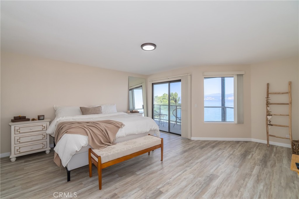 Beautifully updated with stunning views of Clear Lake and Mt Konocti, this condo won’t disappoint. The unit is one of the larger units in the Royale Shores with 1,729 sq ft of living area and one of the very few units that has its very own private boat slip. The home features 3 bedrooms, 2 bathrooms, laundry room, and lake views from the living room, kitchen and primary bedroom. When you enter the home, you will walk into an open, light and inviting floor plan, perfect for entertaining. Step out onto your covered balcony from the living room or from the primary bedroom and take in the beautiful view or catch a stunning sunrise. Kitchen has been elegantly updated with gorgeous granite countertops, new appliances, cabinets and recessed lighting. Primary bath has dual vanity sink, walk-in closet, an additional closet, and a privacy door leading into the toilet and shower. There is ample storage space within the home, big bedrooms, beautiful electric fireplace in living room and a countertop bar. The HOA offers a seasonal solar heated pool, hot tub, clubhouse, BBQ area, pier and dock. The grounds are beautifully landscaped and maintained. You also have your own covered parking space with plenty of room for your boat and an additional storage unit. Within walking distance to shopping and downtown. This waterfront condo has it all, and it's ready for you to come relax and enjoy lake life living.