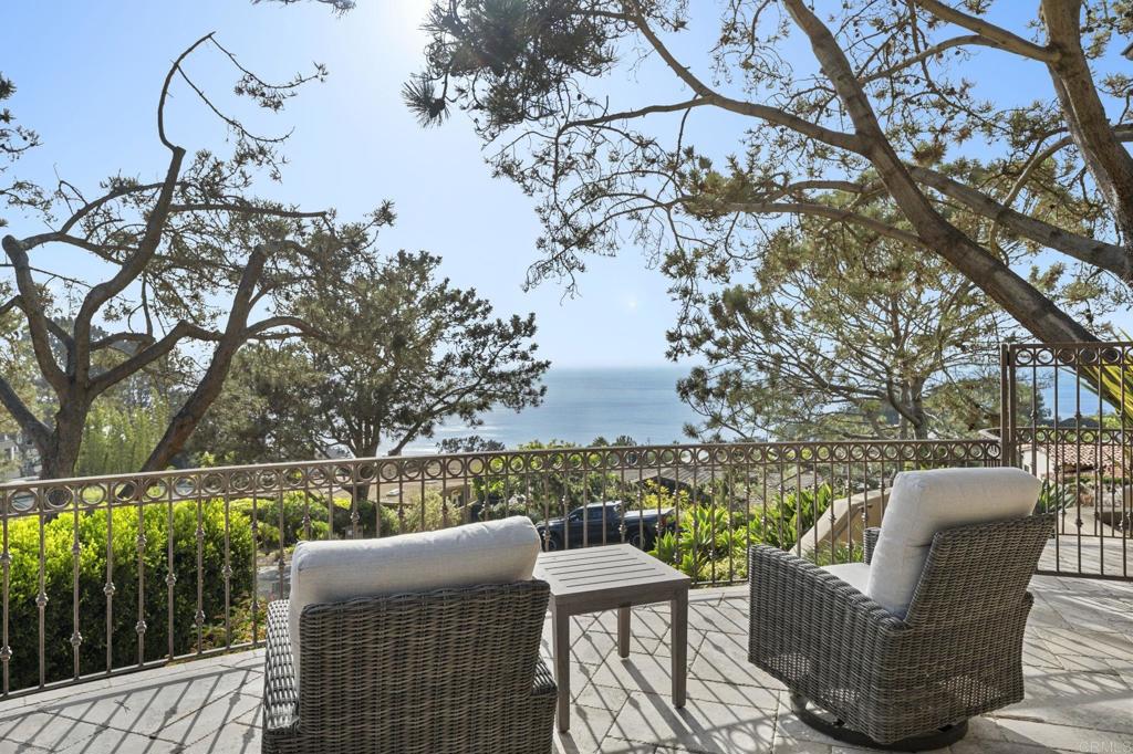 Unrivaled Ocean Views | Private Coastal Estate in Del Mar’s Most Sought-After Location Experience sweeping whitewater ocean views and total privacy from this extraordinary Del Mar coastal estate, perched on a premium hillside lot just moments from the beach and Del Mar Village. Designed by renowned architect Ron Wilson, this custom Santa Barbara-style home blends timeless elegance with modern luxury, offering the best in Southern California indoor-outdoor living. Walls of glass capture dramatic sunsets and panoramic views stretching across the Pacific Ocean, while lush gardens and multiple tranquil seating areas create a serene, resort-like setting. Enjoy true coastal living with a luxurious infinity-edge pool and spa, expansive ocean-view entertaining deck, and seamless flow from indoor to outdoor spaces. Inside, 5,472 SqFt of luxury living is thoughtfully laid out, including a stunning chef’s kitchen with top-tier appliances, a warm and inviting great room, and a private home theater. The primary suite is a true retreat with mesmerizing ocean views, dual walk-in closets, and a spa-like bath with soaking tub and oversized shower. A home elevator, en suite guest rooms, and the option for an approved ADU offer comfort, accessibility, and flexibility. Set on nearly half an acre (17,859 SqFt), this gated estate offers rare privacy while still being just a short walk to Del Mar Beach, award-winning dining, and boutique shopping in Del Mar Village. Whether you're searching for a luxury ocean view home, private Del Mar estate, or a trophy property near the beach, 271 Ocean View delivers an unmatched lifestyle.