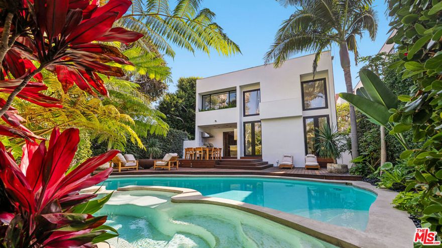 Nestled in the prestigious Malibu Colony, this stunning contemporary estate offers the ultimate in luxury, privacy, and modern design, perfect for serene relaxation and unforgettable entertaining. Upon arrival, the gated courtyard entry leads you into an oasis of tranquility. As you enter the home, you're greeted by a breathtaking two-story great room, awash in natural light streaming through expansive clerestory windows, establishing an awe-inspiring and inviting central gathering space. A cozy sitting area with a sleek fireplace blends seamlessly with the dining area and the gourmet kitchen, which boasts top-of-the-line appliances, custom cabinetry, and a versatile industrial rolling island, making it a chef's dream.The main level also features a convenient laundry room and a spacious ensuite bedroom, ideal for guests. Expansive French and glass pocket doors lead out to the private backyard, designed for outdoor indulgence. A sprawling deck provides ample space for al fresco dining and lounging by the fire pit while the lagoon-style pool and spa beckon for relaxation. The outdoor kitchen is perfect for culinary adventures under the stars, enhancing the home's appeal for entertaining.On the next level, a mezzanine gracefully overlooks the great room, providing a tranquil vantage point to admire the home's stunning architectural details. You'll find another bedroom, bathroom, and a luxurious owner's retreat on this level. This private haven features soaring ceilings, a cozy fireplace seating area with a flat-screen TV, a wall of closets for ample storage, and a private deck. The spa-like ensuite bath is a masterpiece, with a deep soaking tub, dual-head shower, sauna, and steam room, ensuring ultimate relaxation and comfort.For entertainment or additional living space, the upstairs media room provides flexibility and is easily convertible into another bedroom if desired. Ascend to the third level, where a massive ocean-view roof deck awaits, complete with a fire pit sitting area. This panoramic space is ideal for soaking in Malibu's breathtaking coastal views and enjoying warm, sun-drenched days or cool, starlit nights.This extraordinary home offers exclusive beach access in one of Malibu's most elite and desirable neighborhoods. With every detail crafted for luxury and comfort, this Malibu Colony home is not just a place to live but an extraordinary lifestyle.