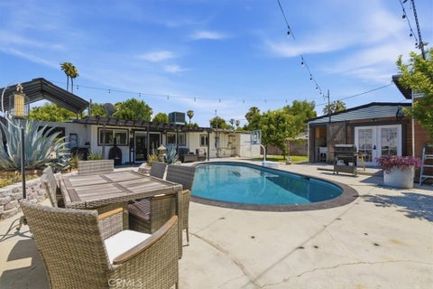 Photo of 7959 Bothwell RD, Reseda, CA 91335 (MLS # SR26101757)