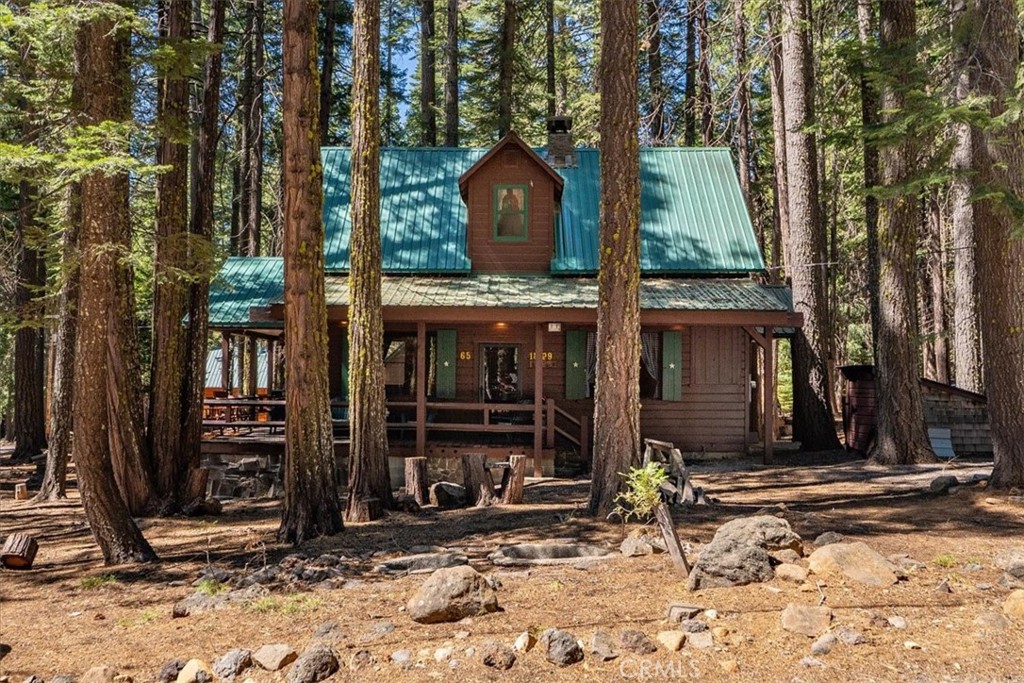 Fully furnished Mill Creek classic mountain cabin retreat. Lots of trees, corner lot, large windows, large deck, covered from the elements yet open for sunny morning coffee. Interior of the home has all the woodsy feeling of a classic mountain cabin: wide plank knotty pine, lodge pole railings, custom built cabinetry that was hand crafted with great attention to detail. The real stone fireplace is truly a work of art. 2 beds and full bath downstairs and 1/2 bath upstairs. Location Location Location! Approximately 5 miles from the southern entrance to Lassen Volcanic National Park, Childs Meadows and the Highlands Ranch Resort, and about 20 miles to Lake Almanor and Chester. On-demand hot water, stacked washer and dryer. ample parking, and great neighbors.