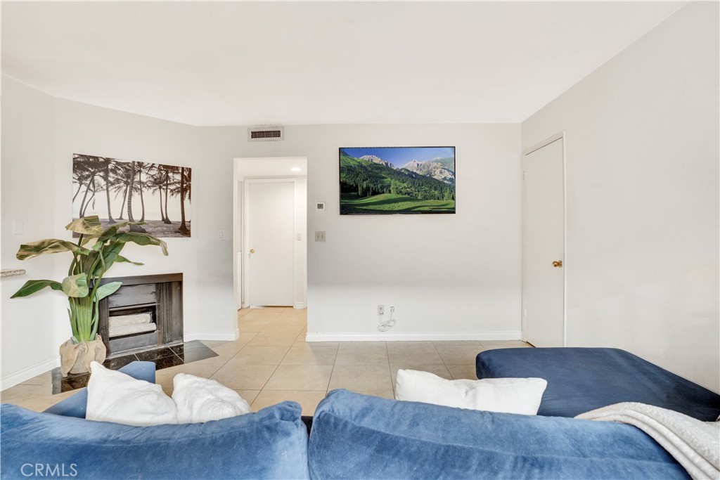 $5,000 SELLER CREDIT TO BUYERS TOWARDS RATE BUYDOWN OR CLOSING COSTS! Stylish Condo Living in the Heart of North Hills! This condo offering space, style, and convenience in a prime North Hills location. This light-filled, multi-level unit features a spacious open floor plan with elegant touches throughout, perfect for modern living and effortless entertaining. Enjoy a bright living room with a cozy fireplace and direct access to a private patio, ideal for morning coffee. The well-appointed kitchen includes granite countertops, stainless steel appliances, and ample cabinet space, all flowing seamlessly into the dining area. Upstairs, you'll find generously sized bedrooms including a spacious primary suite with a walk-in closet and a private en-suite bathroom. With multiple bathrooms, in-unit laundry, and direct access to a private two-car garage, this home combines practicality with comfort. Located in a secure gated community with lush landscaping and well-maintained common areas, this Condo offers peace of mind and pride of ownership. You're just minutes away from shopping, dining, freeways, and local schools—everything you need is within reach. Don't miss your chance—schedule your private tour today!