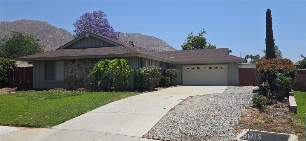FRESH AND CLEAN Roomy 4 bedroom 2 bath home with new flooring, new paint inside and out is ready for adoption!!! The home opens to a large living room with fireplace and large sliding glass doors for easy access to the back yard. The home flows nicely from the living room into the big dining room with new window blinds. The kitchen has lots of counter and cabinet space and yes, a refrigerator in included. All of the 4 bedrooms are spacious with large closets. The master bedroom is huge and open with its own bathroom. The new flooring though out the house is light, modern and easy to keep clean. The back yard is large with a wonderful view of the mountains, perfect for an afternoon sunset and entertaining. The 2 car garage has plenty of storage space with a washer and dryer included. Sure to go fast so do not wait call today for a private viewing.