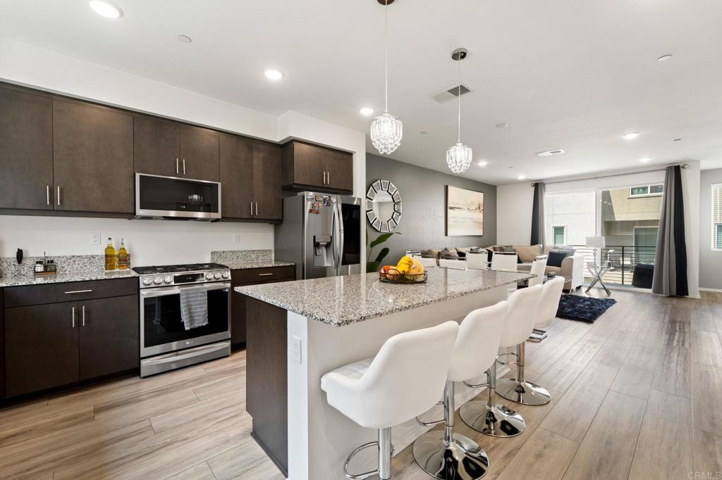 Modern comfort in a beautifully designed newer community! This spacious 4-bedroom, 3.5-bath tri-level townhome has been meticulously maintained by the current owners, featuring a smart layout with a private bedroom and full bath on the first floor—ideal for guests, extended family, or a home office. The main level boasts an open-concept kitchen with granite counters, stainless steel appliances, and a large island perfect for entertaining. Enjoy access to a resort-style pool, playgrounds, and well-kept green spaces. Located in a highly rated school district with easy access to freeways, shopping, and dining. FHA & VA approved—don’t miss this move-in ready gem!