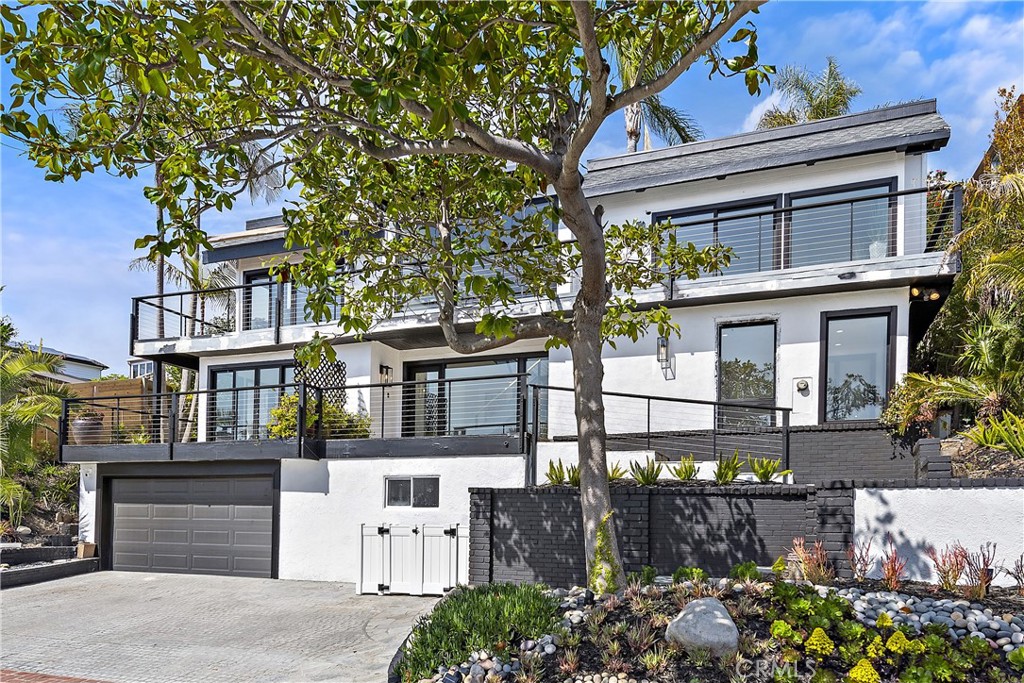 Spectacular furnished 5-Bedroom Home with Ocean Views and Easy Beach Access! This stunning 5-bedroom, 4.5 bathroom home boasts breathtaking ocean views and is just a short walk from one of the most beautiful beaches in the area. As you step inside, you'll be greeted by an open and inviting living space, complete with large windows that let in plenty of natural light and showcase the gorgeous ocean views. The living room is perfect for relaxing with friends and family, while the adjacent dining area provides ample space for entertaining and hosting dinner parties. The spacious kitchen features stainless steel appliances, beautiful countertops, and plenty of cabinet space for all your cooking essentials. Whether you're whipping up a quick snack or preparing a full gourmet meal, you'll have everything you need right at your fingertips. Each of the five bedrooms is comfortable and inviting, with plenty of closet space and natural light. The four bathrooms are clean and modern, with plenty of space for getting ready in the morning or unwinding after a long day. Outside, you'll enjoy stunning views of the ocean and easy access to the beach, allowing you to take advantage of all the area has to offer. There's also a spacious patio area perfect for outdoor dining or simply enjoying the gorgeous coastal views. Other amenities include a washer and dryer, central heating and air conditioning, and plenty of parking for you and your guests. Located in one of the most desirable neighborhoods in the area, you'll love being just a short drive away from top-rated restaurants, shops, and entertainment options. Don't miss your chance to experience beachside living at its finest.