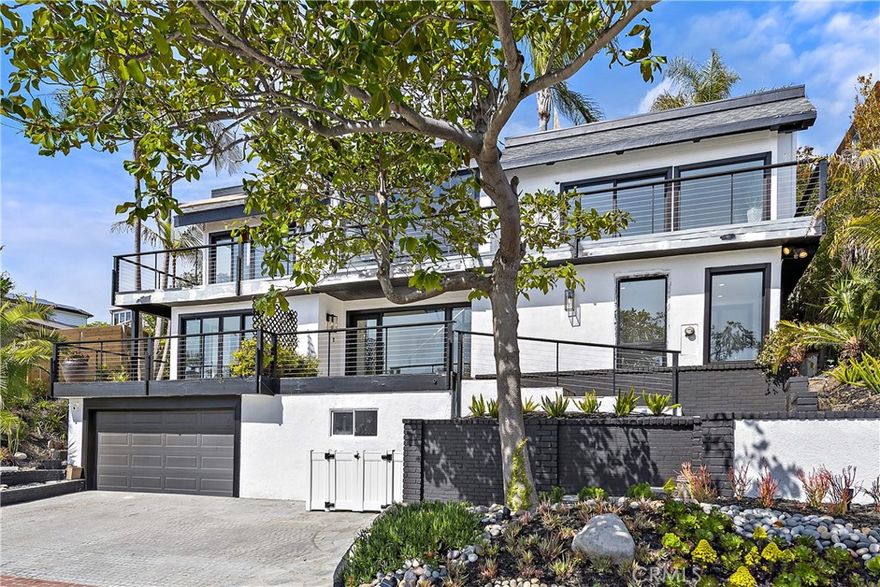 Spectacular furnished 5-Bedroom Home with Ocean Views and Easy Beach Access! This stunning 5-bedroom, 4.5 bathroom home boasts breathtaking ocean views and is just a short walk from one of the most beautiful beaches in the area. As you step inside, you'll be greeted by an open and inviting living space, complete with large windows that let in plenty of natural light and showcase the gorgeous ocean views. The living room is perfect for relaxing with friends and family, while the adjacent dining area provides ample space for entertaining and hosting dinner parties. The spacious kitchen features stainless steel appliances, beautiful countertops, and plenty of cabinet space for all your cooking essentials. Whether you're whipping up a quick snack or preparing a full gourmet meal, you'll have everything you need right at your fingertips. Each of the five bedrooms is comfortable and inviting, with plenty of closet space and natural light. The four bathrooms are clean and modern, with plenty of space for getting ready in the morning or unwinding after a long day. Outside, you'll enjoy stunning views of the ocean and easy access to the beach, allowing you to take advantage of all the area has to offer. There's also a spacious patio area perfect for outdoor dining or simply enjoying the gorgeous coastal views. Other amenities include a washer and dryer, central heating and air conditioning, and plenty of parking for you and your guests. Located in one of the most desirable neighborhoods in the area, you'll love being just a short drive away from top-rated restaurants, shops, and entertainment options. Don't miss your chance to experience beachside living at its finest.