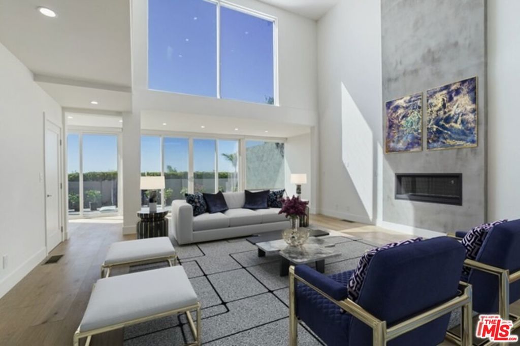 Perched atop the iconic Point Dume bluffs with spectacular ocean/coastline views and private stairs to the beach, this gated 3-bedroom beach retreat features stylish and tastefully designed updates throughout. Step inside to discover wide plank floors and a light-filled, open-concept living space with soaring ceilings overlooking the private outdoor patio. The bespoke designer kitchen includes top-of-the-line appliances/finishes and flows seamlessly into the warm living and dining areas - perfect for entertaining or relaxing. Two private guest bedrooms share a spacious, beautifully appointed bath area on the main level. Upstairs, a serene primary suite offers a private balcony, an inviting bath area with a soaking tub, Carrera book-matched shower space and custom designer closet. A lofted creative space offers additional flexibility, making it ideal as a home office or reading nook, complete with ocean views and stunning sunsets. And the sunset views are remarkable. Just a few steps away is the exclusive private staircase that accesses Westward Beach and Point Dume State Beach. An attached 2-car garage (with laundry area) and additional parking space behind the gates is also featured. A rare opportunity to live an effortless, elevated lifestyle close to stores and restaurants in one of Malibu's most coveted coastal enclaves.