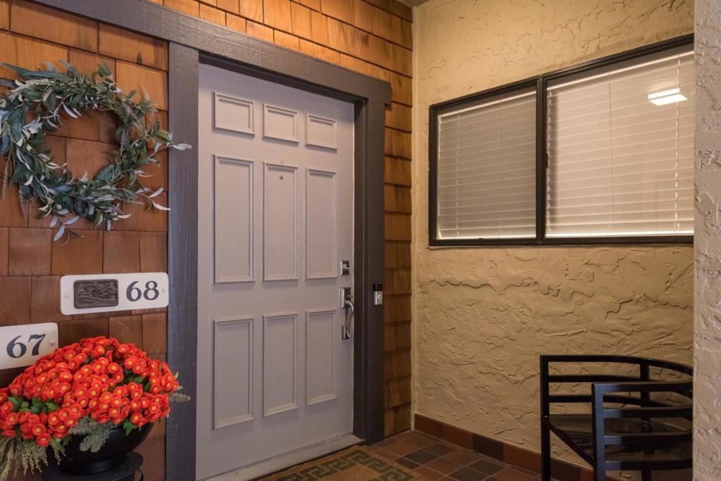 Stunning & exclusive one level home in this sought-after gated community w/ incredible views of the prestigious Sharon Heights Golf & Country Club. Beautifully remodeled in 2020, this open floor plan includes a gourmet chefs kitchen w/ new quartz countertops, an abundance of storage, new stainless appliances with bright kitchen nook. Vaulted ceilings abound as you enter the spacious great room w/ gas fireplace, dining room and picturesque windows. The exquisite master suite and additional bedroom are lovely retreats with large walk-in closets and luxurious remodeled baths. Other features include white oak flooring, Nest thermostat, LED lighting, two parking spaces w/storage room, sparkling pool/spa, community clubhouse and an expansive private covered balcony w/ views of the lush redwood trees & golf course. In close proximity to downtown Menlo Park, Palo Alto, Stanford, venture capital firms & easy access to shopping, trails & highway 280. Do not miss this gem in prime Menlo Park!