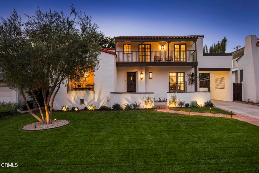 This stunning 1929 Spanish Colonial Revival has been beautifully restored, blending historic character with modern luxury. Set on a generous Altadena lot, the 4-bedroom, 3-bathroom home showcases arched doorways, vaulted ceilings with exposed beams, Malibu tile accents, and fireplaces that reflect its Spanish charm. A large window in the living room fills the space with natural light and frames views of the front yard, highlighted by a mature olive tree. The gourmet kitchen offers custom cabinetry with quartz countertops, Viking appliances, and a custom wet bar with walnut shelving. The dining room features a Juliet balcony, while the primary suite enjoys a private balcony with mountain views--creating inviting spaces to enjoy both morning light and evening sunsets. The main level includes a bedroom and bathroom with a shower, while upstairs provides three additional bedrooms and two bathrooms, including the primary suite with a spa-inspired bath and mountain views. Modern updates include hardwood floors, marble and porcelain finishes, frameless glass showers, premium fixtures, recessed lighting, fully updated plumbing and electrical, and dual HVAC systems with Nest control. Professionally designed landscaping with a flagstone courtyard, ambient lighting, and lush greenery creates a private retreat just moments from Altadena's hiking trails, parks, shopping, and local eateries. This turnkey residence offers both classic beauty and a lifestyle of refined elegance.