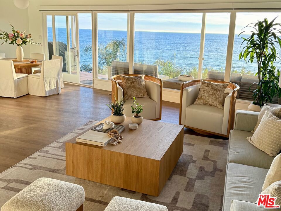 Welcome to this breathtakingly remodeled 2-bedroom, 2-bathroom coastal retreat located at the coveted edge of Pacific Palisades and Malibu. With unobstructed, panoramic views of the Pacific Ocean and just steps away from Castle Rock Beach via a convenient pedestrian bridge, this home embodies California living at its finest.