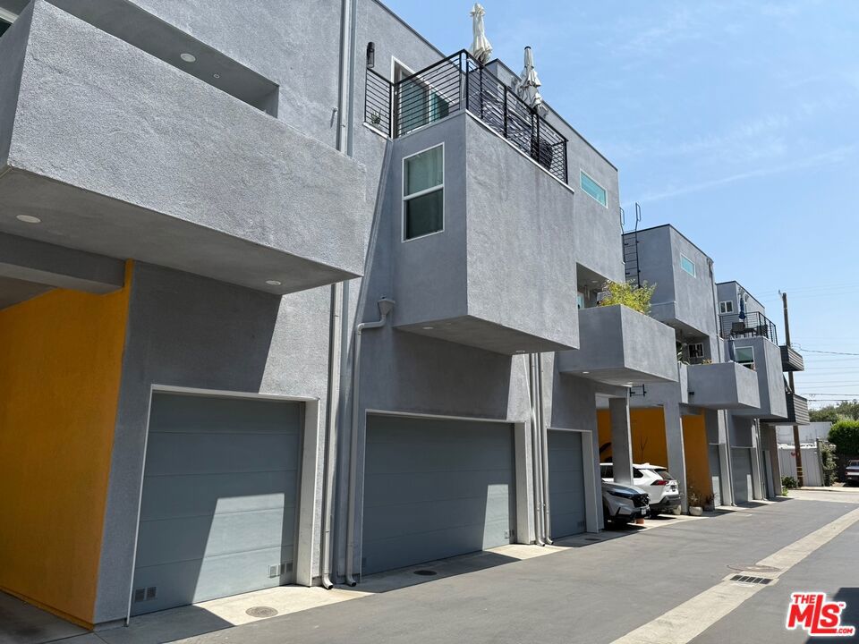 Welcome to Coolidge Place, built in 2021a modern collection of three-level live/work homes in vibrant Elysian Valley (Frogtown), just moments from Atwater Village. The first floor features a versatile flex space with a half bath, directly connected to the attached two-car garage with EV charging capability. Perfect as a home office, art studio, workshop, or guest suite, this space is designed to adapt to your lifestyle. Upstairs, the second level offers two private bedroom suites, each with its own full bath and shower. The top floor showcases an open-concept kitchen and living area with sliding glass doors to a spacious balcony-ideal for dining al fresco or relaxing under the evening sky. The kitchen includes ample cabinet storage, newer stainless steel appliances, and a seamless flow into the living room for effortless entertaining. Additional highlights include solar panels for energy savings, dual-zone HVAC, and a laundry closet with a new washer and dryer. Enjoy walkable access to the LA River bike path, Spoke Caf, Wax Paper, local art galleries, and a variety of popular restaurants. Coolidge Place offers quick connectivity to Silver Lake, Echo Park, Downtown, and all of Northeast LA right in the heart of the evolving LA River corridor.