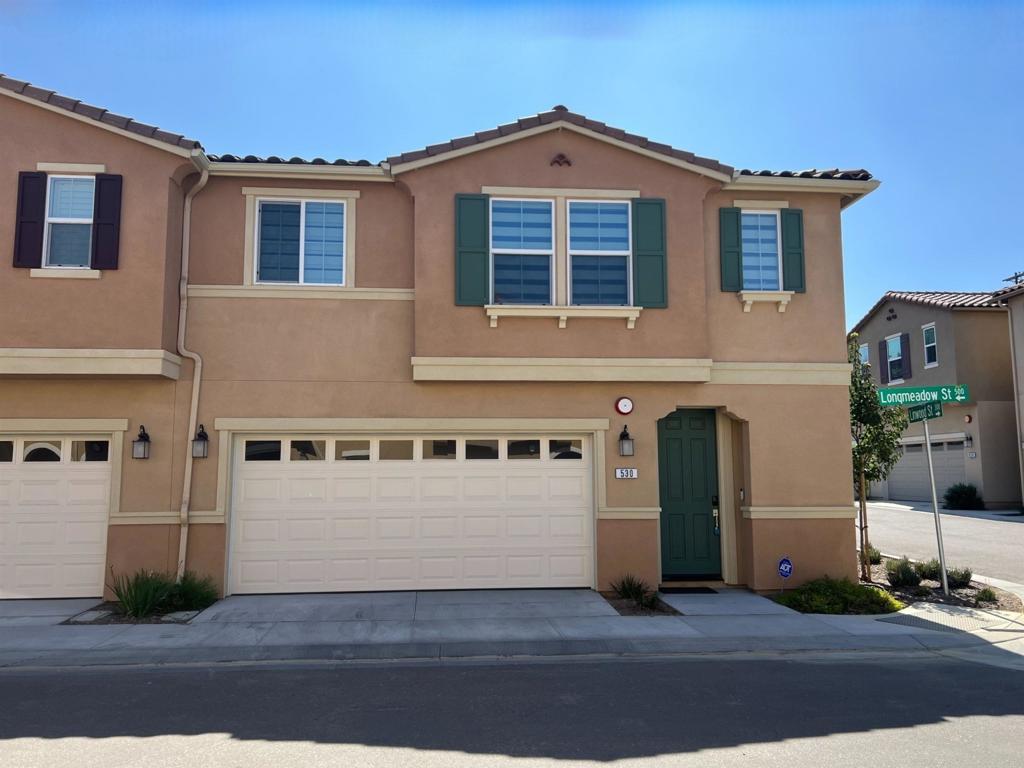Welcome to your new home in the highly desirable Silverado community in Vista! Available September 5th! This beautifully maintained smart-home is an end unit and offers a perfect blend of comfort, style, and convenience. Enjoy a generous living area with plenty of natural light, perfect for entertaining or relaxing with family. Three full bedrooms plus a large loft. Modern kitchen fully equipped with stainless steel LG appliances, induction stove, ample cabinet space, bar stool area, quartz counter tops and a cozy breakfast nook. Solar panels, dual pane windows, central A/C, ceiling fans, water softener, all hard-surface flooring. Primary suite features a walk-in closet and an ensuite bathroom with dual sinks and a soaking tub. A private backyard with a patio, ideal for outdoor dining and relaxation. The patio furniture and landscape maintenance are included. Laundry room upstairs with LG washer and dryer included. Attached 2-car garage with additional storage space, EV charging. As part of the Silverado Homeowners Association, residents enjoy access to a well-maintained dog park, playground, and an electric barbecue. Peaceful and friendly community close to schools, shopping centers, dining options, and easy access to major highways. Pets will be considered. Each pet is $100 additional rent per month. Don’t miss out on this fantastic rental opportunity in one of Vista’s most sought-after neighborhoods!