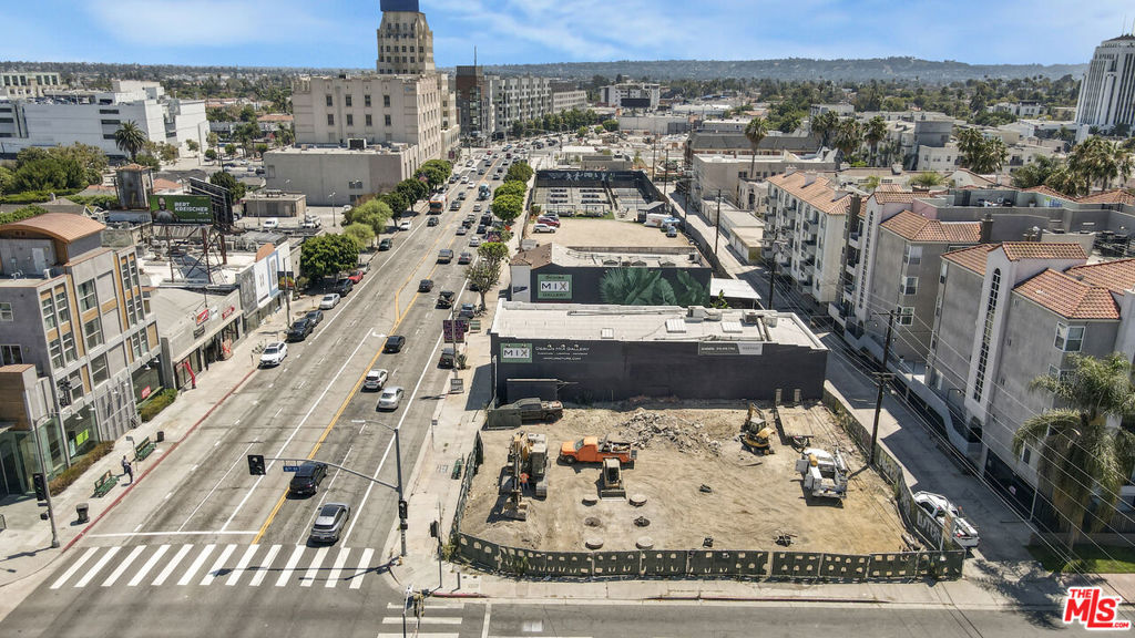 Prime redevelopment opportunity! ~9,888 SF corner lot, steps from the Wilshire/La Brea Metro Station (anticipated Q4 2025). High visibility, Located in the CHIP Transit Oriented Incentive Area (TOIA) 3 and Opportunity Corridor Incentive Area OC-3, offering additional housing incentives. This corner lot has potential for an 8-story mixed-use development with up to 90 units and 4,200 SF of retail space and/or restaurant (subject to buyer verification). As a vacant lot, there are no existing tenants to relocate or replace. Situated in the heart of Los Angeles' vibrant Miracle Mile, 601 S. La Brea Avenue offers a rare ~9,888-square-foot corner lot in one of the city's most dynamic and high-traffic corridors. Located steps from the upcoming Wilshire/La Brea Metro Station (expected to open in Fall 2025), this prime vacant parcel benefits from exceptional visibility, with over 75,000 vehicles per day and significant pedestrian traffic. Surrounded by Hollywood, West Hollywood, Melrose, Fairfax, Hancock Park, Beverly Grove, and Koreatown, the site is immersed in a bustling hub of mixed-use developments, Class-A offices, and premier retail and dining destinations like Republique and Leopardo. Positioned within a Transit Oriented Communities (TOC) Tier 4 zone, and designated Tier 3 under the City's Housing Element Incentive Program (CHIP Ordinance/TOIA), the lot offers flexible zoning and development incentives, including no parking requirements and no height restrictions, making it ideal for multifamily, retail, or mixed-use projects. Nearby attractions such as LACMA, La Brea Tar Pits, and The Grove draw a steady stream of locals and tourists, while the area's dense population of over 40,000 within a one-mile radius and an average household income exceeding $120,000 underscores its strong investment potential. This is a generational opportunity to acquire a premier vacant lot in a rapidly evolving Los Angeles corridor. 601 S. La Brea Avenue is strategically located at the corner of 6th Street and La Brea Avenue, adjacent to major developments, including a proposed 250-unit hotel/residential project and the highly anticipated Metro D Line expansion connecting Downtown LA to Westwood by 2026. The property's prime location, high visibility, and proximity to cultural and entertainment hubs make it an ideal canvas for developers and investors seeking to capitalize on the area's growth trajectory. Potential for an 8-story mixed-use development featuring up to 90 dwelling units and 3,800 square feet of commercial space and/or restaurant space are available, subject to buyer verification and approval by relevant agencies. With advantageous zoning and no restrictive municipal regulations, this corner lot presents unmatched potential for immediate development or long-term investment in one of Southern California's most sought-after neighborhoods. All information is provided for informational purposes only and is not guaranteed. Buyer to conduct their own due diligence and independently verify all details, including zoning, CHIP eligibility, development incentives, and project feasibility. The lot is currently vacant, eliminating any need for tenant relocation or demolition of existing structures.
