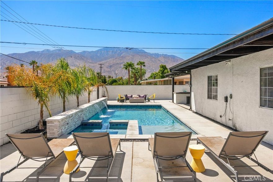 Welcome to this stunning home located in one of Palm Springs' most desirable neighborhoods. This versatile property is ideal as a primary residence (or 2nd home), rental income property, or short-term rental (buyer to verify with City pertaining to allowance of SRT, permits, fees, etc). The front unit features three spacious bedrooms, two of which are ensuite, and three modern bathrooms, along with a newly updated kitchen complete with sleek cabinets and countertops installed in 2022. The interior boasts new flooring throughout, providing a fresh and contemporary feel. The second attached unit offers a studio and one bathroom, as well as a convenient kitchenette, making it perfect for guests or as an income-generating rental. Front and back unit have separate gas and power meters. The outdoor amenities are equally impressive, with a new pool and spa built in 2022, featuring a heated pool with soothing waterfalls for ultimate relaxation. The property also includes solar panels with two backup batteries installed in 2024, ensuring energy efficiency and significant savings. For those who love to entertain, there is a custom-built barbecue area, ideal for hosting gatherings. Additionally, the property comes with a detached two-car garage and a huge driveway that provides ample parking. This exceptional property offers a unique opportunity to enjoy the sunny Palm Springs lifestyle while benefiting from the flexibility to generate income. Don't miss out on this gem in a prime location!