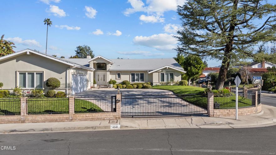 Welcome to this stunning, custom-reimagined estate nestled on a premier corner lot in the highly sought-after Tarzana hills. Originally built in 1965 but completely rebuilt in 2000, this home was meticulously constructed to achieve the timeless beauty and structural integrity it showcases today. The moment you step through the front door, you are greeted by an elegant formal living room featuring views of the lush backyard, immediately setting a tone of serenity and light. Designed for those who love to host, the heart of the home is an entertainer's delight, boasting a chefs dream kitchen with an oversized central island that serves as the focal point, complemented by high-end finishes and extensive built-in functional cabinetry for seamless organization. Adjacent to the kitchen, the spacious formal dining room offers a refined space for hosting guests in style. Every bedroom in this residence is a true suite, featuring its own private en-suite bathroom. Custom closets were built in each bedroom, one offers a premium cedar-lined closet, adding a touch of classic craftsmanship and protection for your wardrobe. The floor plan flows effortlessly to the exterior, where the backyard oasis awaits. Whether you're hosting a summer gathering or enjoying a quiet evening, the sparkling pool and manicured grounds offer the perfect backdrop. The home is fully enclosed by both walls and a controlled privacy gate, offering a secluded sanctuary. A 3 car garage provides ample space for vehicles plus dedicated storage areas.Experience the rarity of a home at 4240 Reyes Dr, built for both grand entertaining and intimate comfort--a true masterpiece of custom estate charm in the heart of Tarzana.