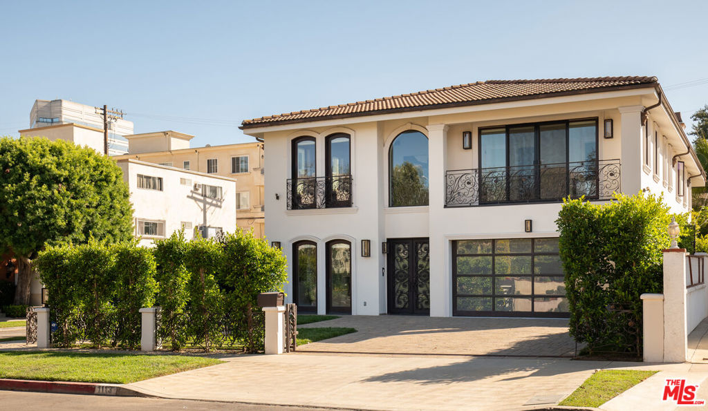 Located North of Wilshire in prime Brentwood, 1113 Amherst is a custom-built home originally constructed in 2010 and fully remodeled in 2025. Offering incredible value for a move-in-ready home in Brentwood, this 4 bed, 5.5-bath turnkey residence spans just under 5,000 sq ft of living space on a 6,000 sq ft lot. The home features a thoughtfully designed floor plan with four well-appointed bedrooms upstairs and a bonus room with a full bath on the entry level, perfect for a guest suite, gym, or home office. The expansive primary suite includes a seating area, walk-in closet, and spa-like bath. The chef's kitchen is equipped with top-of-the-line Sub-Zero, Wolf, and Miele appliances, quartz countertops, travertine floors, an oversized fridge, a center island, and a large walk-in pantry. It seamlessly flows into the formal living room, dining area, and backyard, creating an ideal space for relaxing or entertaining. This residence is designed for modern living with integrated smart home technology, including Sonos sound, a security system, and temperature controls. A 2-car garage adds convenience, and the location offers proximity to top-rated schools, Erewhon, Montana Avenue shopping and restaurants, Santa Monica beaches, and the best of Westside LA.