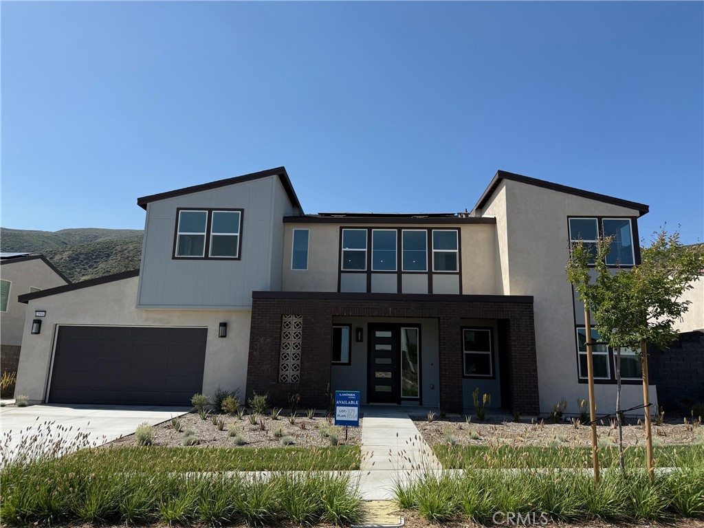 This stunning 2-story single-family home features a sleek Mid-Century Modern exterior and sits on an expansive 11,872 sq. ft. lot. With 5 bedrooms, a spacious loft, 4.5 bathrooms, and 3,612 sq. ft. of thoughtfully designed living space, it offers both style and functionality. The open-concept main floor includes a gourmet kitchen with upgraded countertops, a large great room, and a guest suite, while the upstairs hosts a luxurious primary suite, versatile loft, and additional bedrooms. Enjoy indoor-outdoor living with a covered patio and ample parking in the 3-car tandem garage. Upgraded flooring and premium finishes throughout complete this exceptional home. Narra Hills is a gated community nestled in the hills with picturesque scenery. The community will offer a contemporary amenity space, Pool, Pickleball Courts, Jacuzzi, Dog Park, Clubhouse, Exercise room. Now is the time to get into this luxury neighborhood! Home ready for move-in.