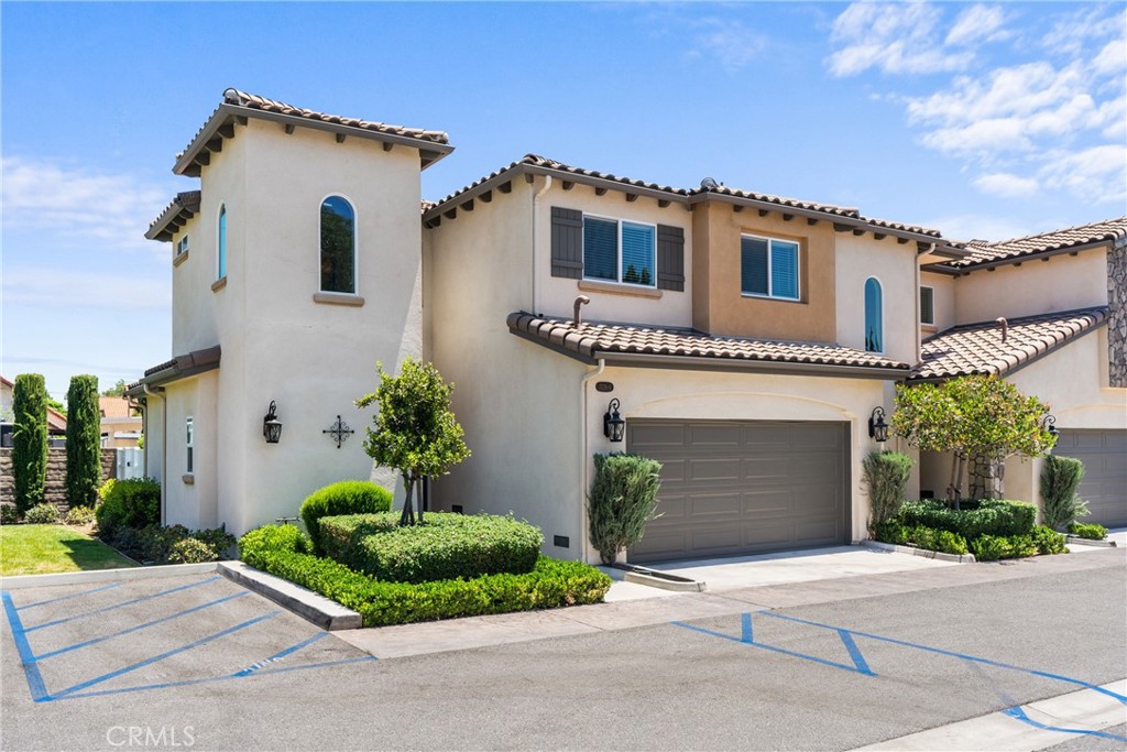 Welcome to your dream oasis in the heart of Simi Valley! This 2017 build is located in the highly desirable Bella Vista gated community, offering just under 1,400 sq. ft. of stunning modern amenities. This gorgeous 2-story, end-unit, offers 3 bedrooms and 2.5 baths with an attached 2 car garage. The custom fireplace, with upgraded recessed lighting, is the WOW factor you are looking for when you enter your home. The open concept kitchen leaves nothing to be desired, with beautiful white shaker cabinets, subway tile backsplash, stainless steel appliances, pendant lights, barstool seating and beautiful quartz countertops to complete the vibe! This beautiful interior includes 3 bedrooms, all upstairs, including a master bedroom with an attached walk-in closet and bathroom suite. An additional full bathroom is located upstairs, next to ample hall storage, with the half bathroom conveniently located downstairs for guests. A private backyard featuring an avocado tree and lime tree, a fountain, and access to the shared side grass area is what makes this unit special. Within Bella Vista this home is THE one that is most desirable because of all of its upgrades and location in the community. Snag this fresh beauty while you can, as it is sure to go fast!