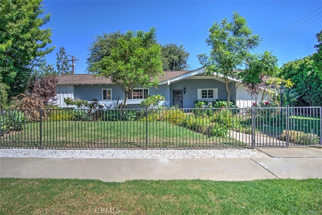 Welcome to 12472 Woodlawn Ave in the highly sought after charming area of North Tustin Neighborhood! This amazing Single Story Residence features 4 bedrooms, 2 baths! TRUELY TURNKEY CONDITION .. .. .. BRIGHT & OPEN LAYOUT.. Totally Remodeled Home. Two car garage is situated on a very private, 10,560 sq. ft. private lot. As you enter this beautifully remodeled home there is a large family room and kitchen. The kitchen is featuring a range, microwave, white shaker cabinets and quartz countertops. New Luxury Vinyl plank flooring throughout the home and New interior paint. A peaceful well landscaped private gated front yard. Backyard is very spacious, great for entertainment. Home has RV /Boat Access and Storage Capability. Close to major freeways, I-5 and I-55 freeway, great restaurants, award winning top ranked schools and shopping! Enjoy the good life in North Tustin and come visit this fabulous home today!